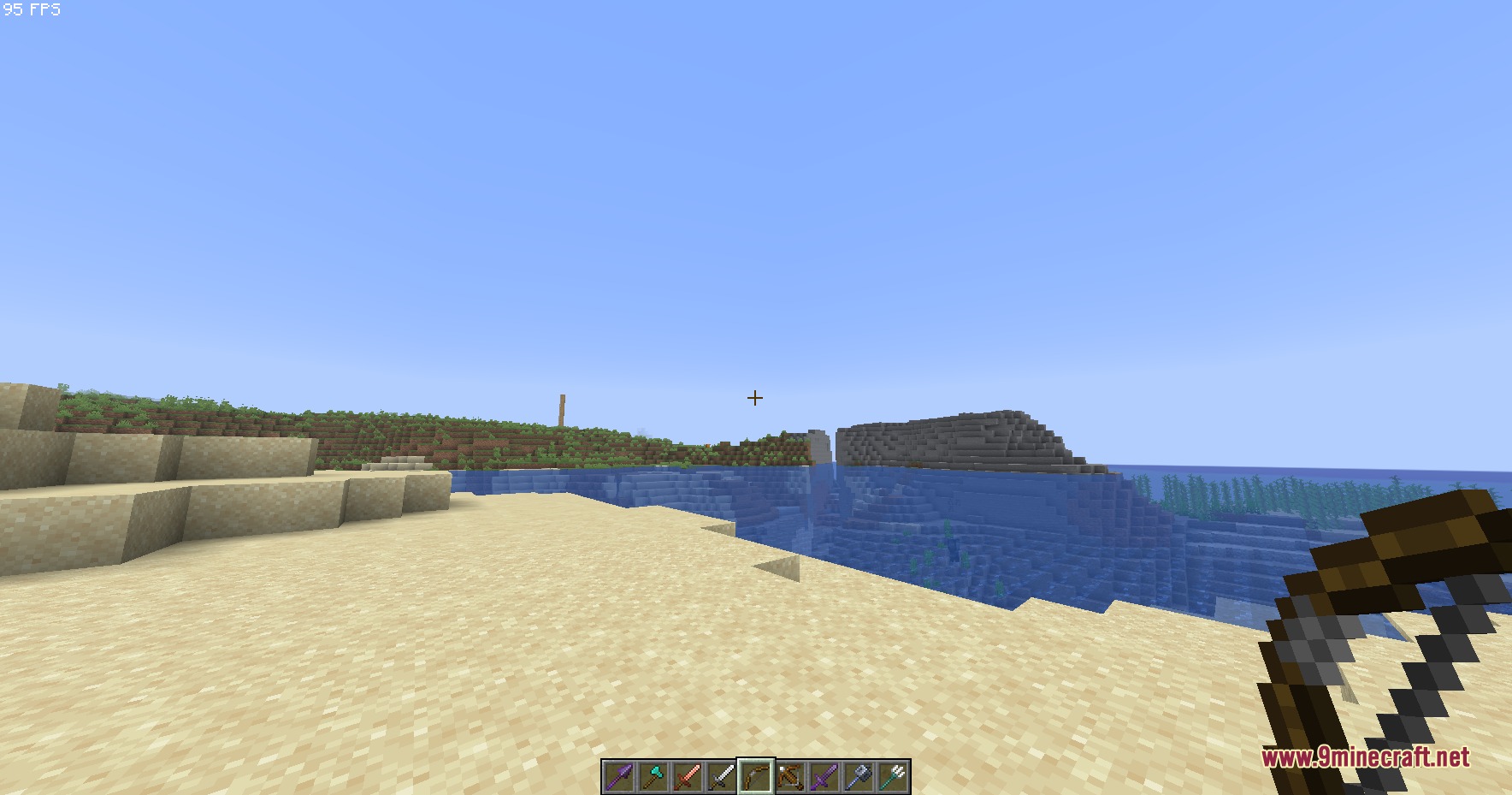 Small Hand Tools Resource Pack Screenshot 6 A player holds a small bow while looking out at the ocean