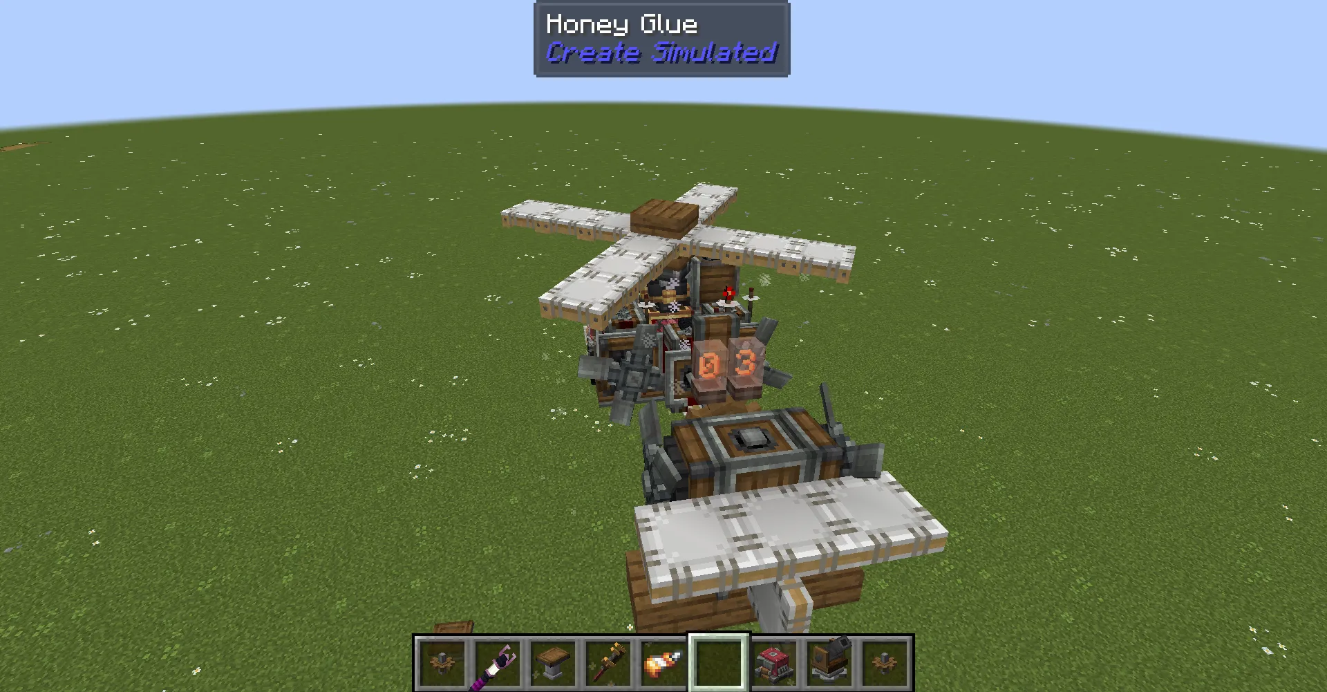 Small helicopter schematic using honey glue and white sails in Minecraft world