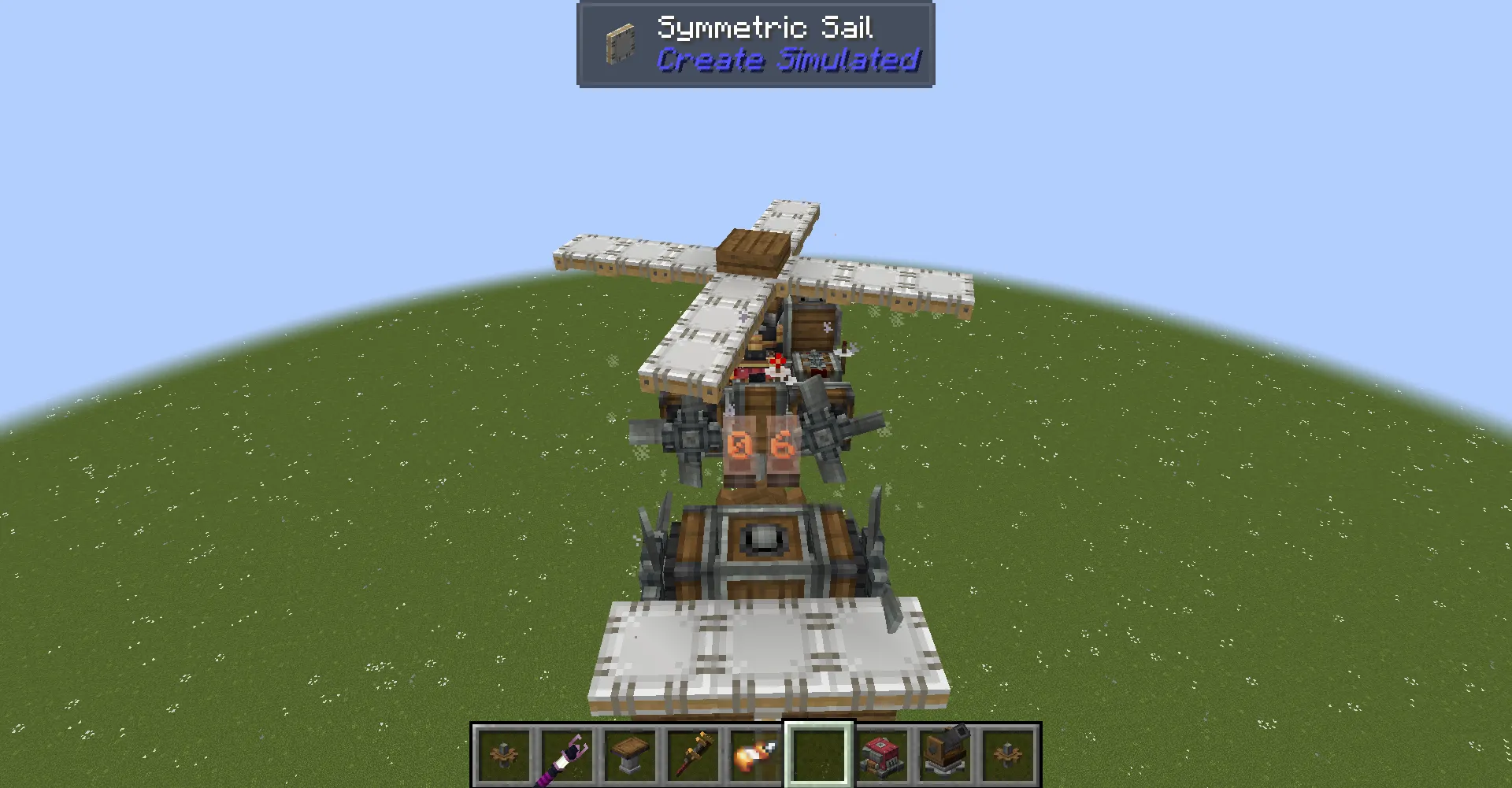 Rear view of a compact helicopter flying over a flat green field
