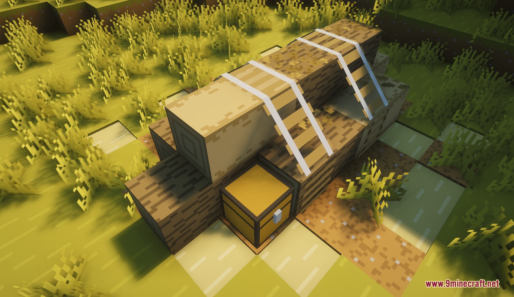 Small Structures Mod Screenshot 6 Stacked logs tied with ropes and a chest found in a grassy biome