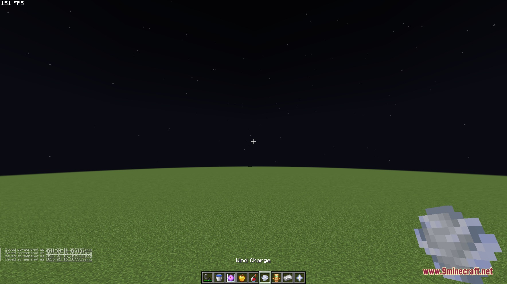 Small Utills Resource Pack Screenshot 8 A player holds a small Wind Charge item in a flat world
