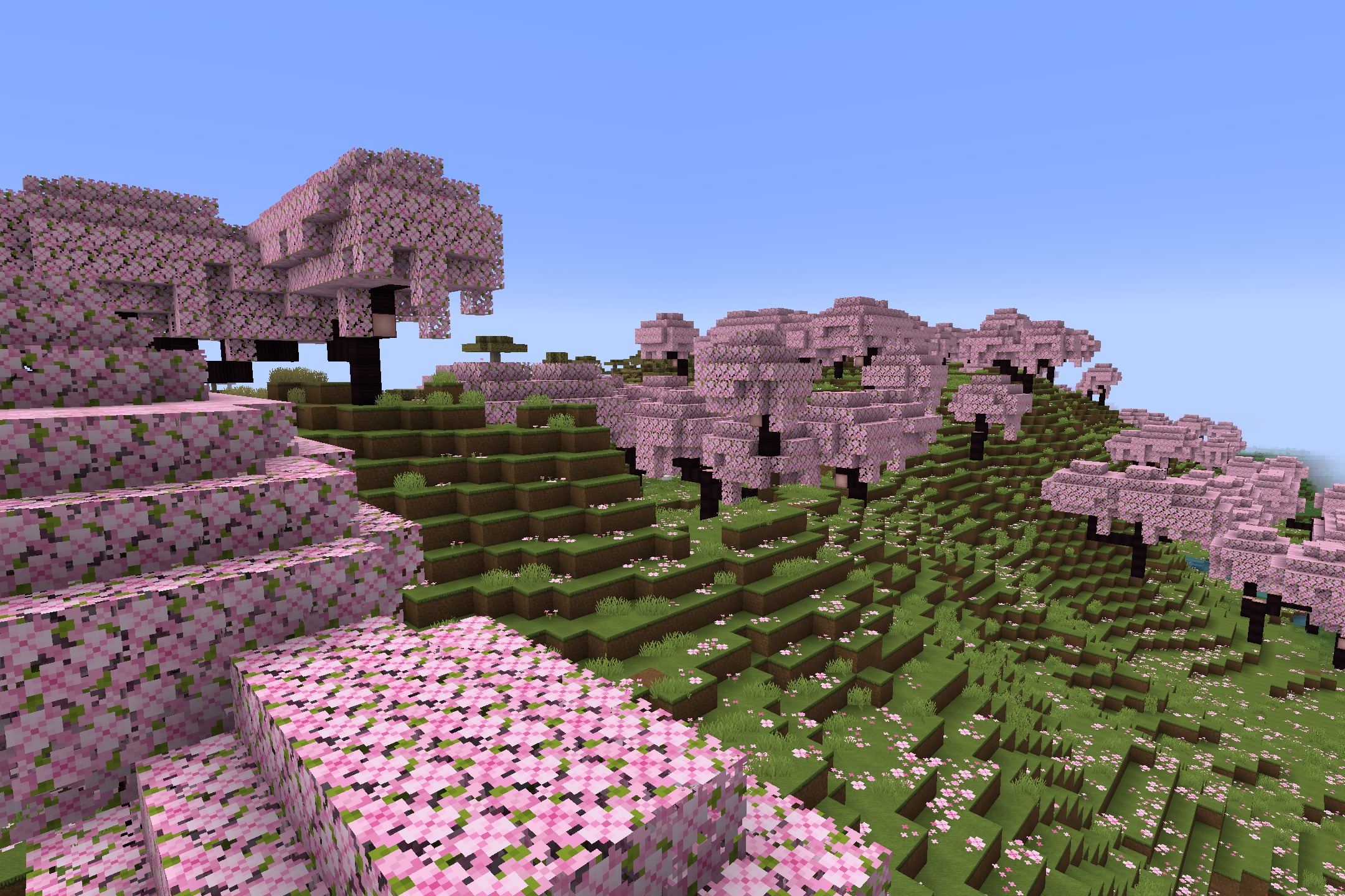 Soartex_Fanver - Rebirth Resource Pack Screenshot 1 Smooth pink cherry blossom trees blooming across a vibrant green Minecraft hillside