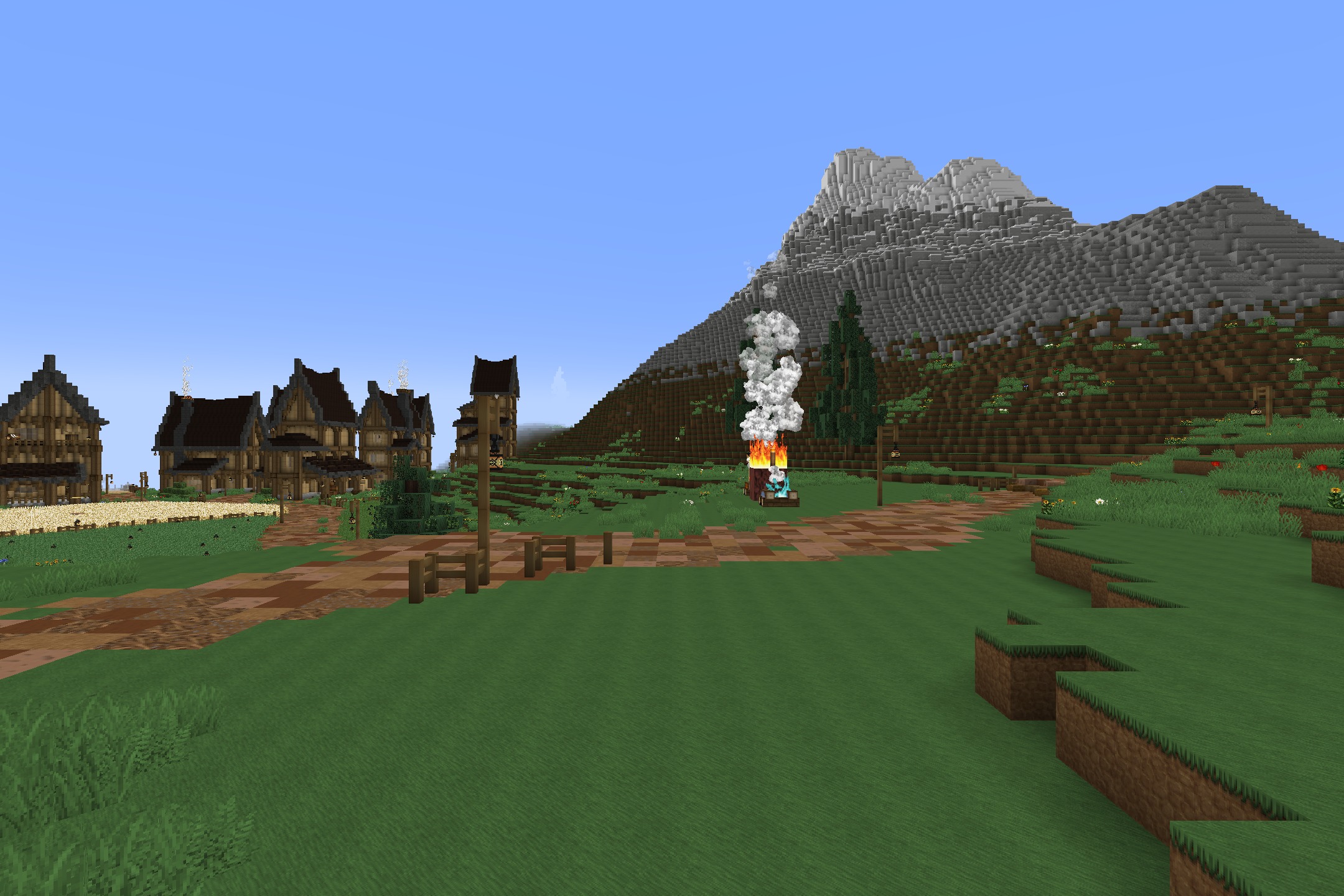 Soartex_Fanver - Rebirth Resource Pack Screenshot 2 Detailed medieval village houses situated near a large mountain with smooth textures