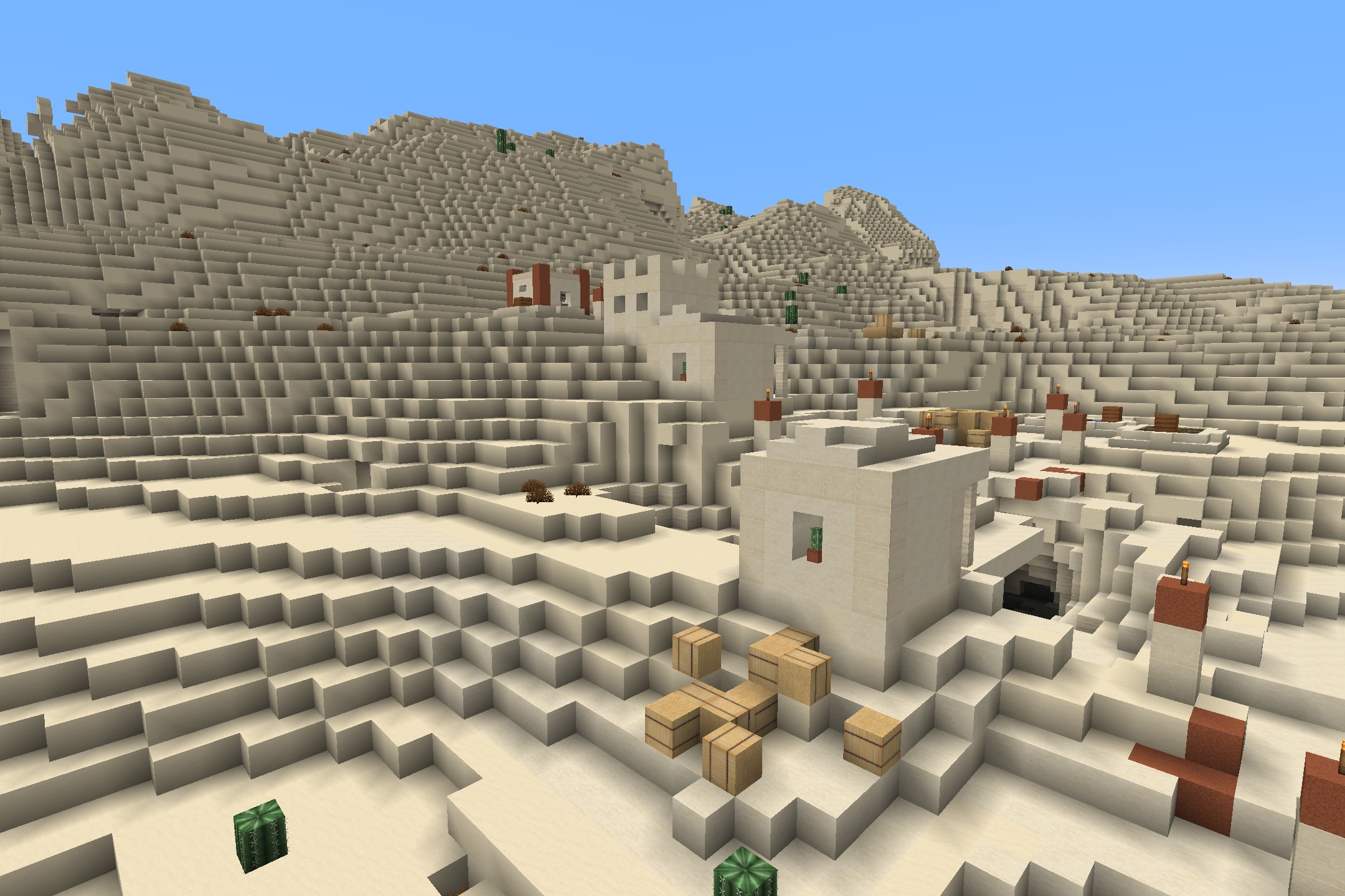 Soartex_Fanver - Rebirth Resource Pack Screenshot 5 A desert village with smooth sandstone buildings and hay bales in Minecraft