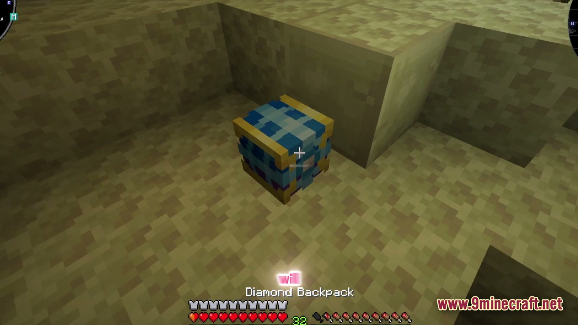 Society Sunlit Cobblemon Modpack Screenshot 4 A blue and gold Diamond Backpack item placed on the ground in a desert biome