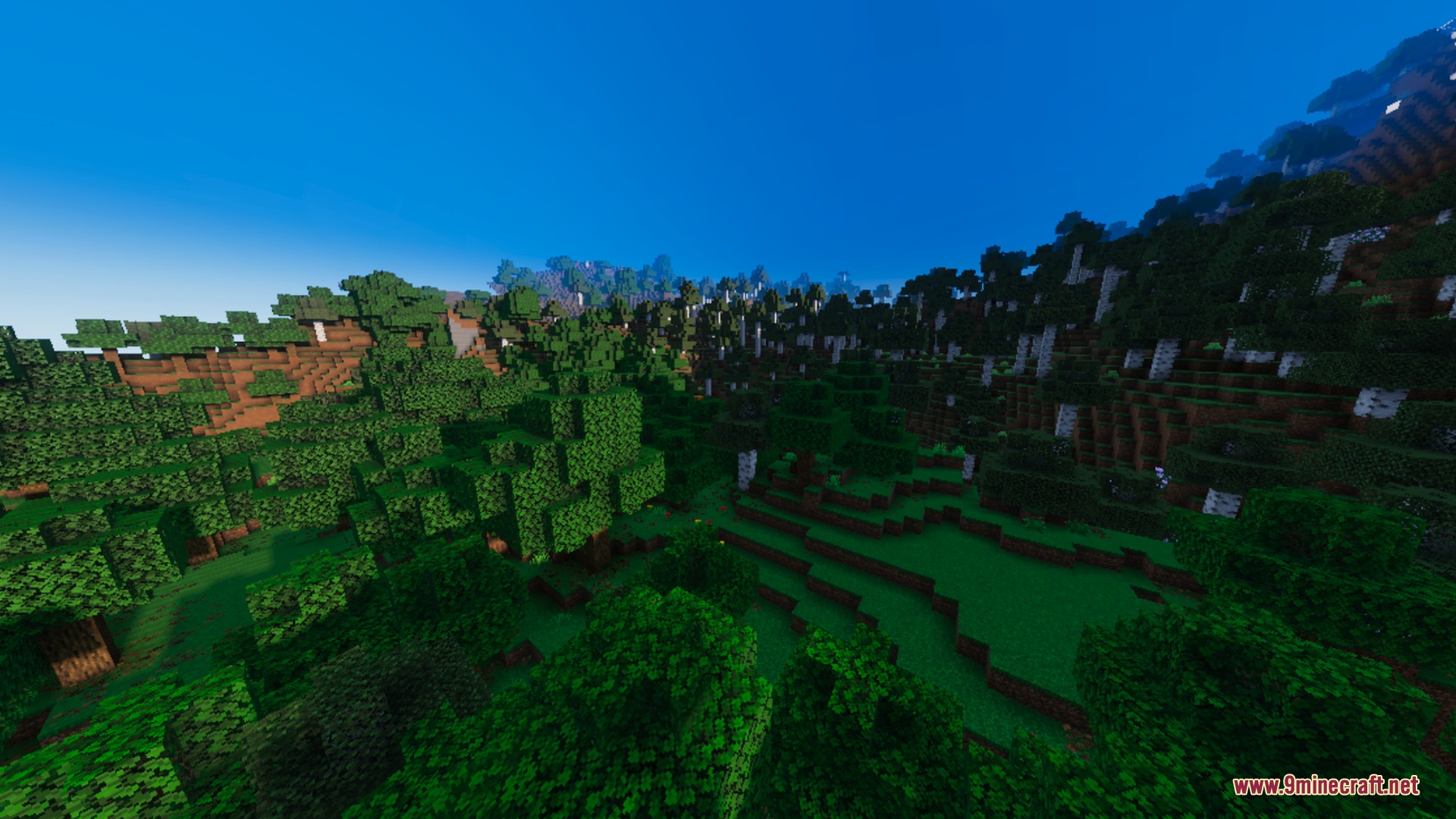 Solumn Visuals Shader Screenshot 7 A scenic view of lush green hills and forests under a clear sky