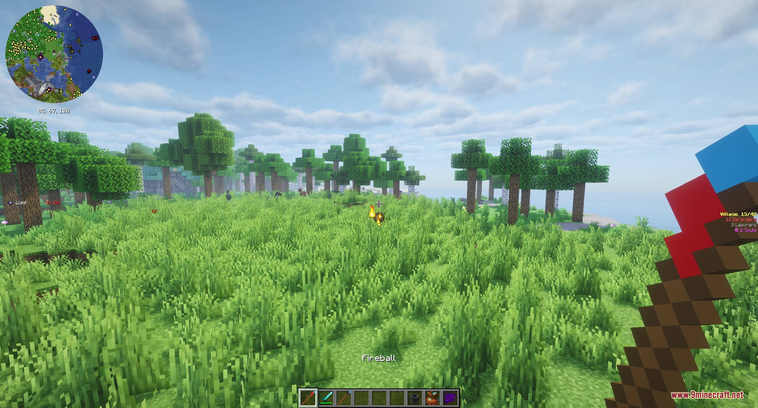 Spells & Spellcrafting Mod Screenshot 2 A player shoots a fireball spell across a grassy field with a wand