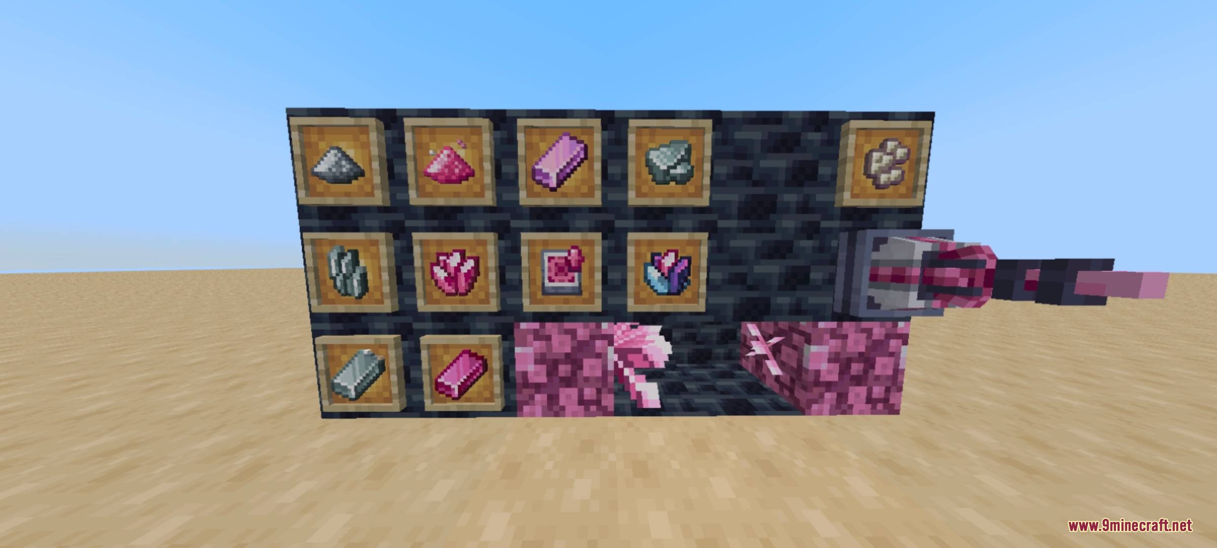 Pink crystals and technical machine components displayed on a dark wall