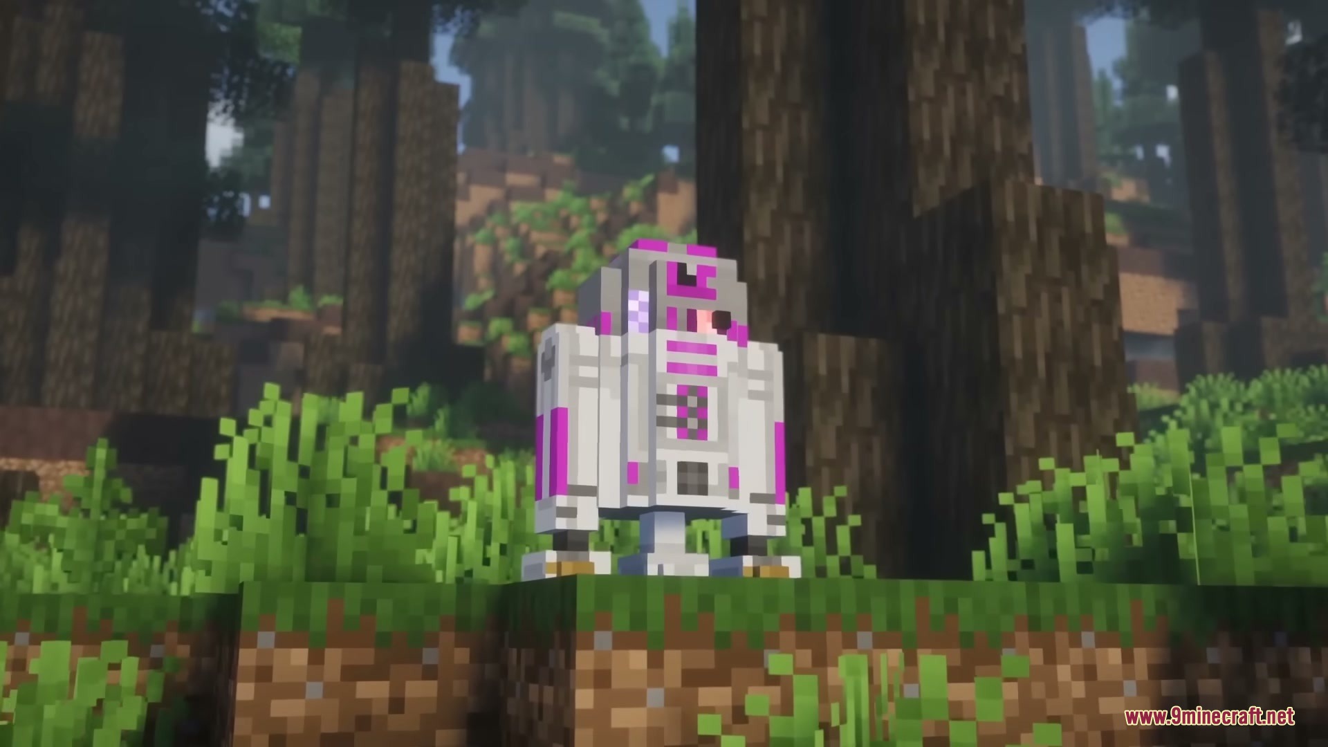 A pink and white Astromech droid standing on a grass block