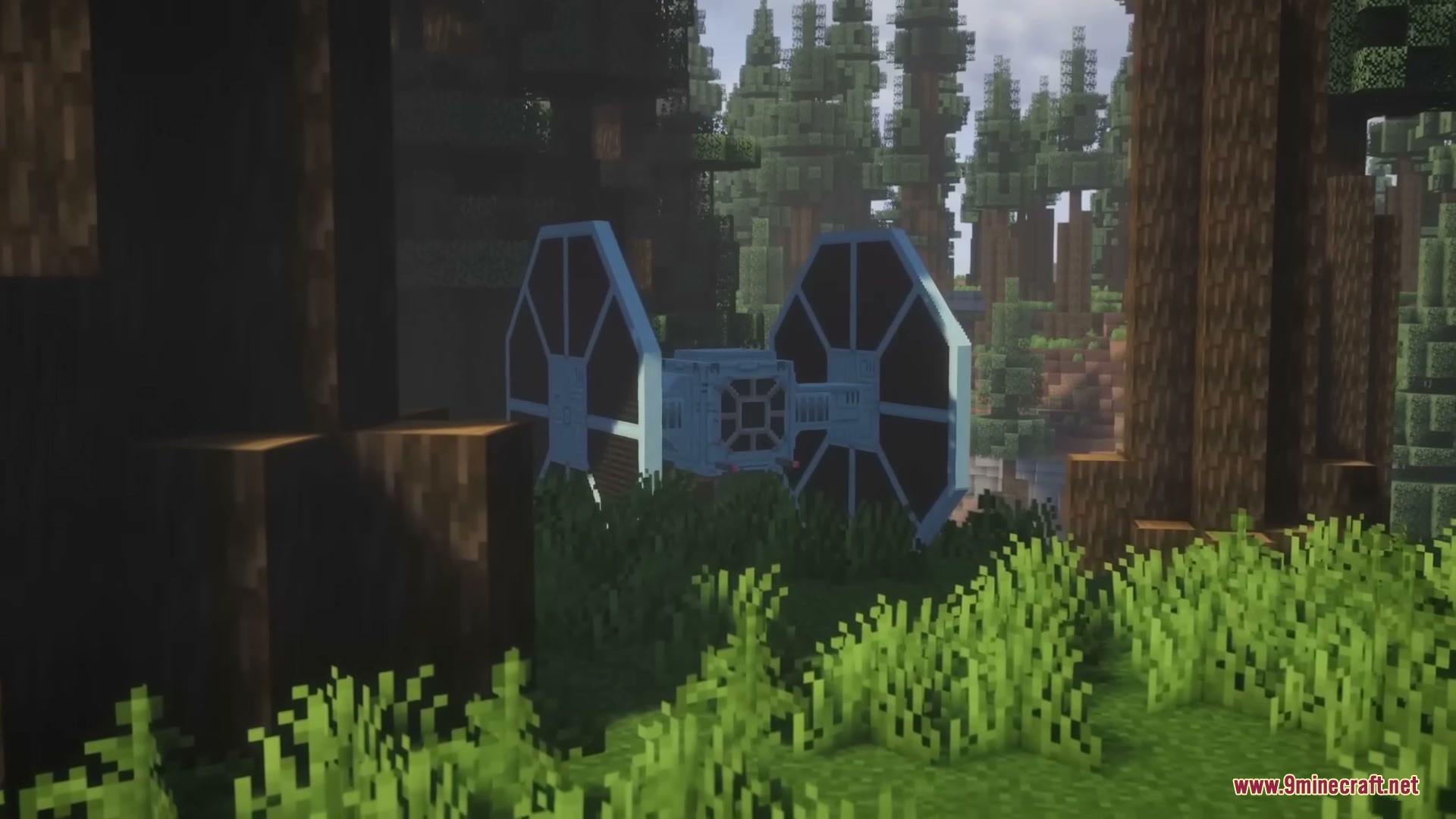 A TIE Fighter parked between tall trees in a dense forest biome