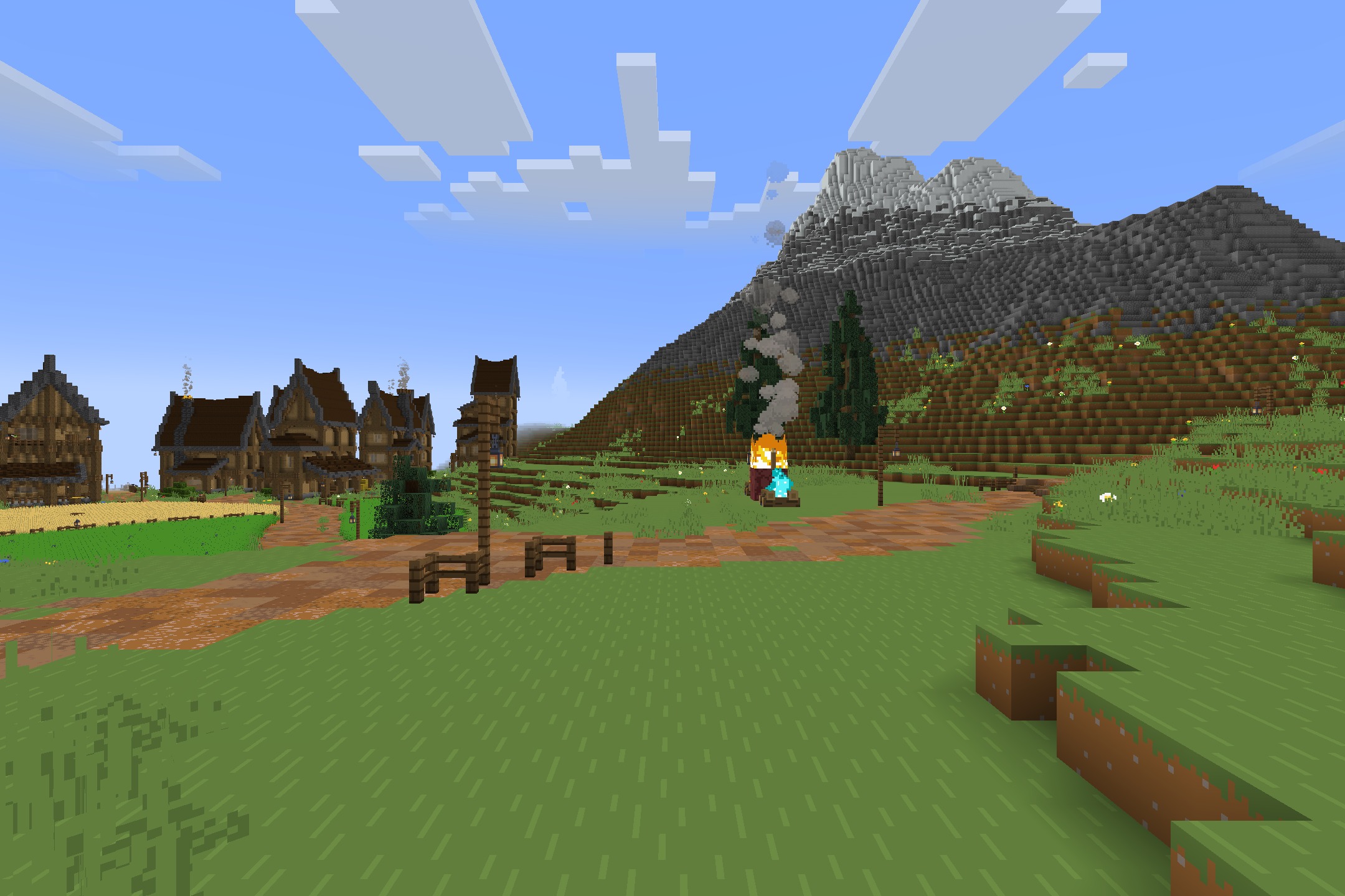 Starboyz2743 PvP Pack Resource Pack Screenshot 2 A village with wooden houses and a campfire near a large stone mountain