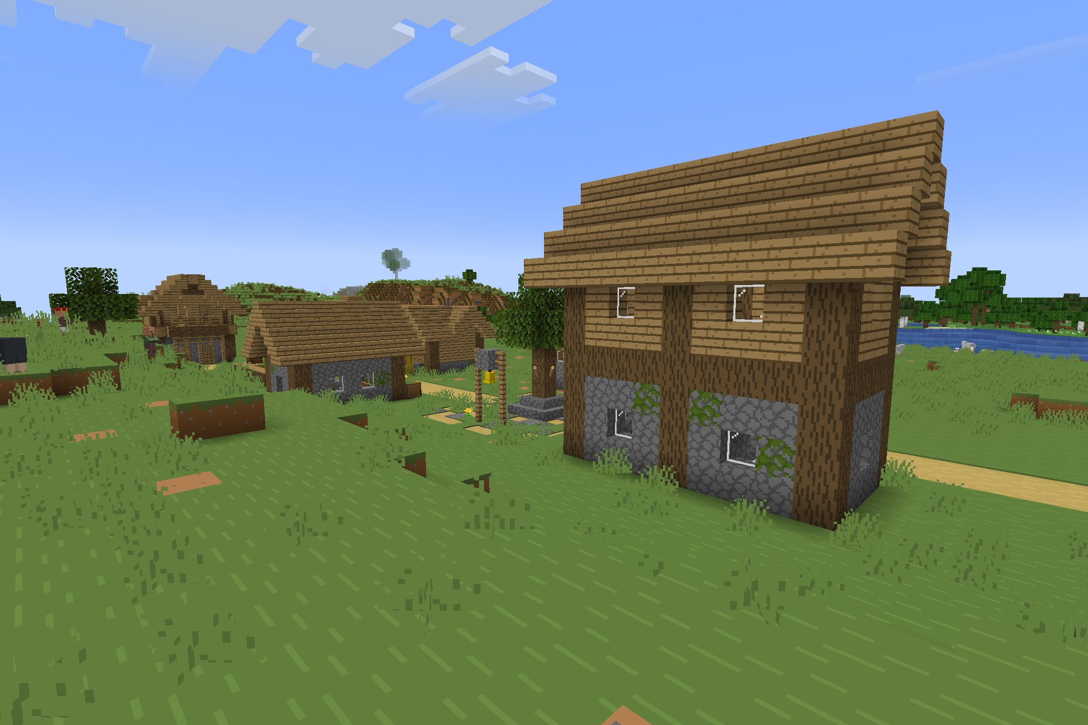 Starboyz2743 PvP Pack Resource Pack Screenshot 3 A large wooden house stands in a village under a clear sky