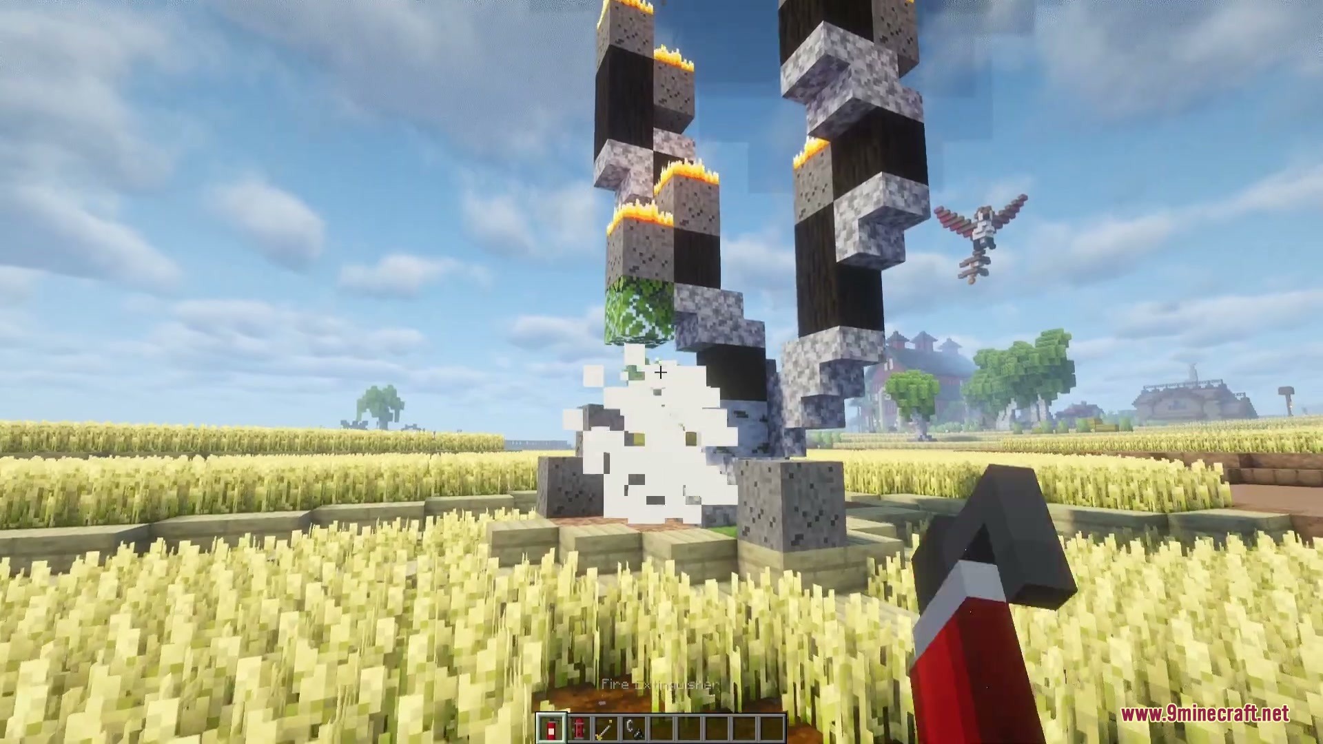 Player uses a fire extinguisher to put out flames on a charred tree