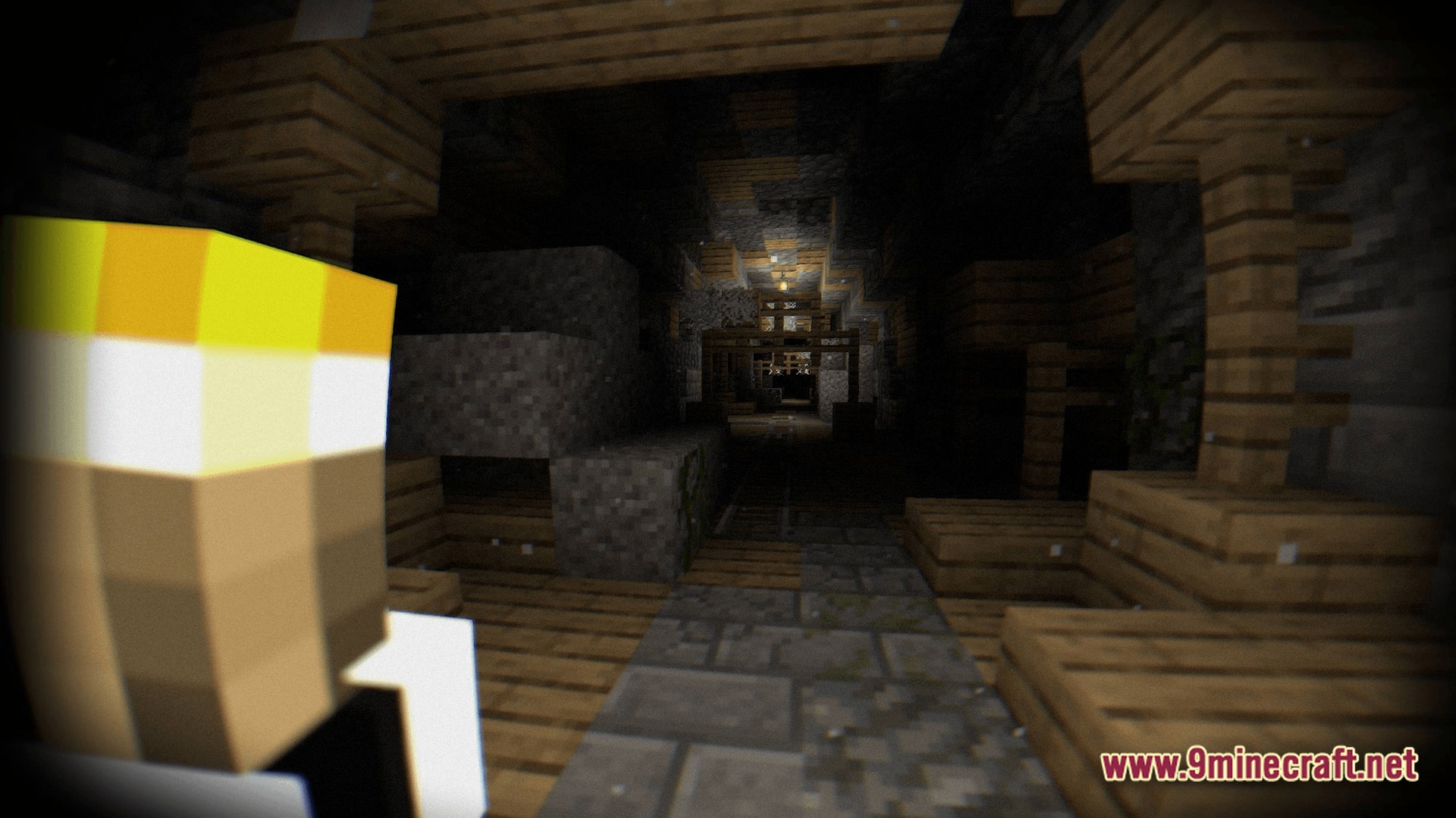 A player character looks down a dark, abandoned mineshaft tunnel with wooden supports and stone floors