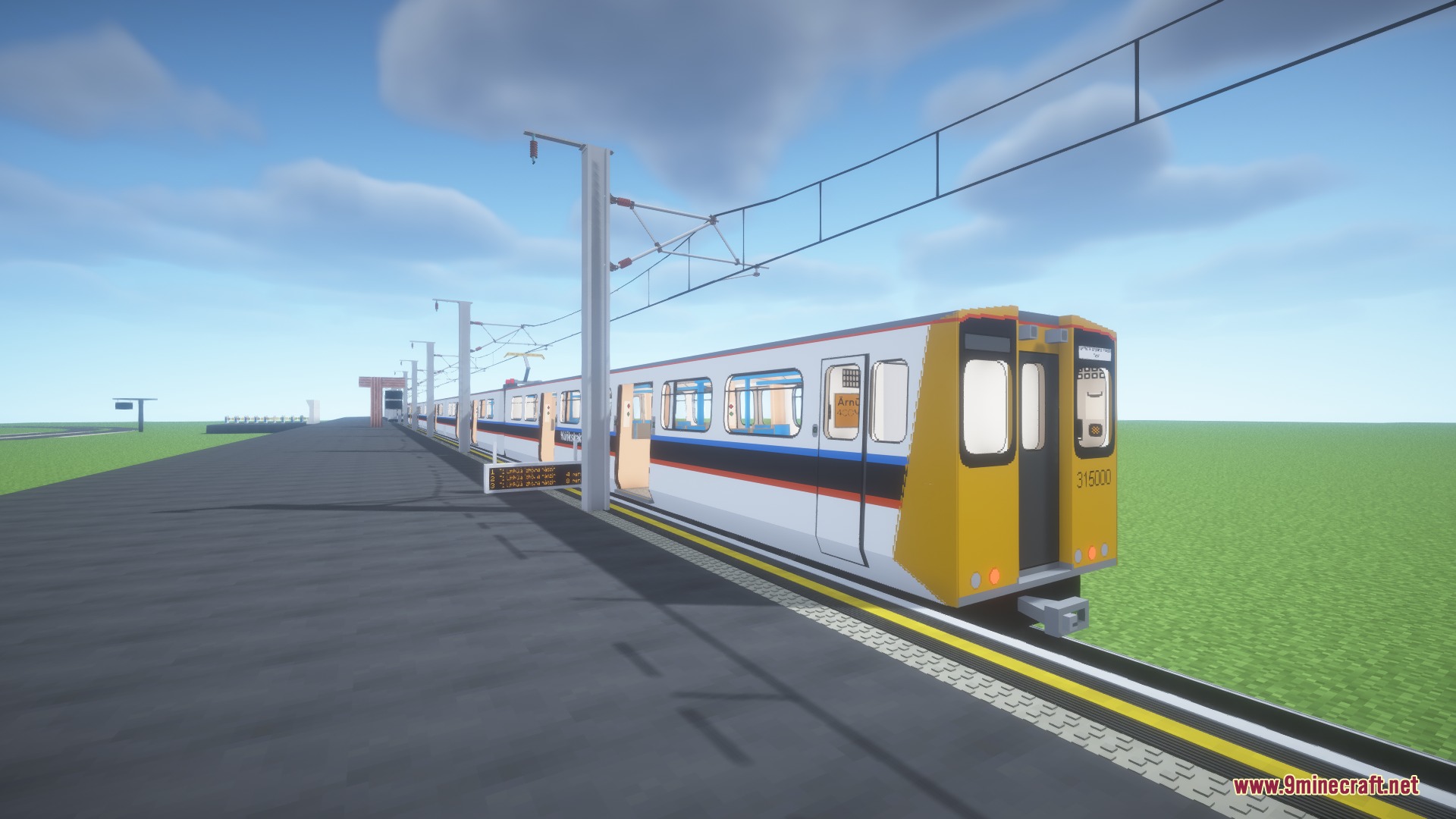 Steel Pulse Transit Resource Pack Screenshot 4 A long commuter train stopped at a station platform under overhead wires