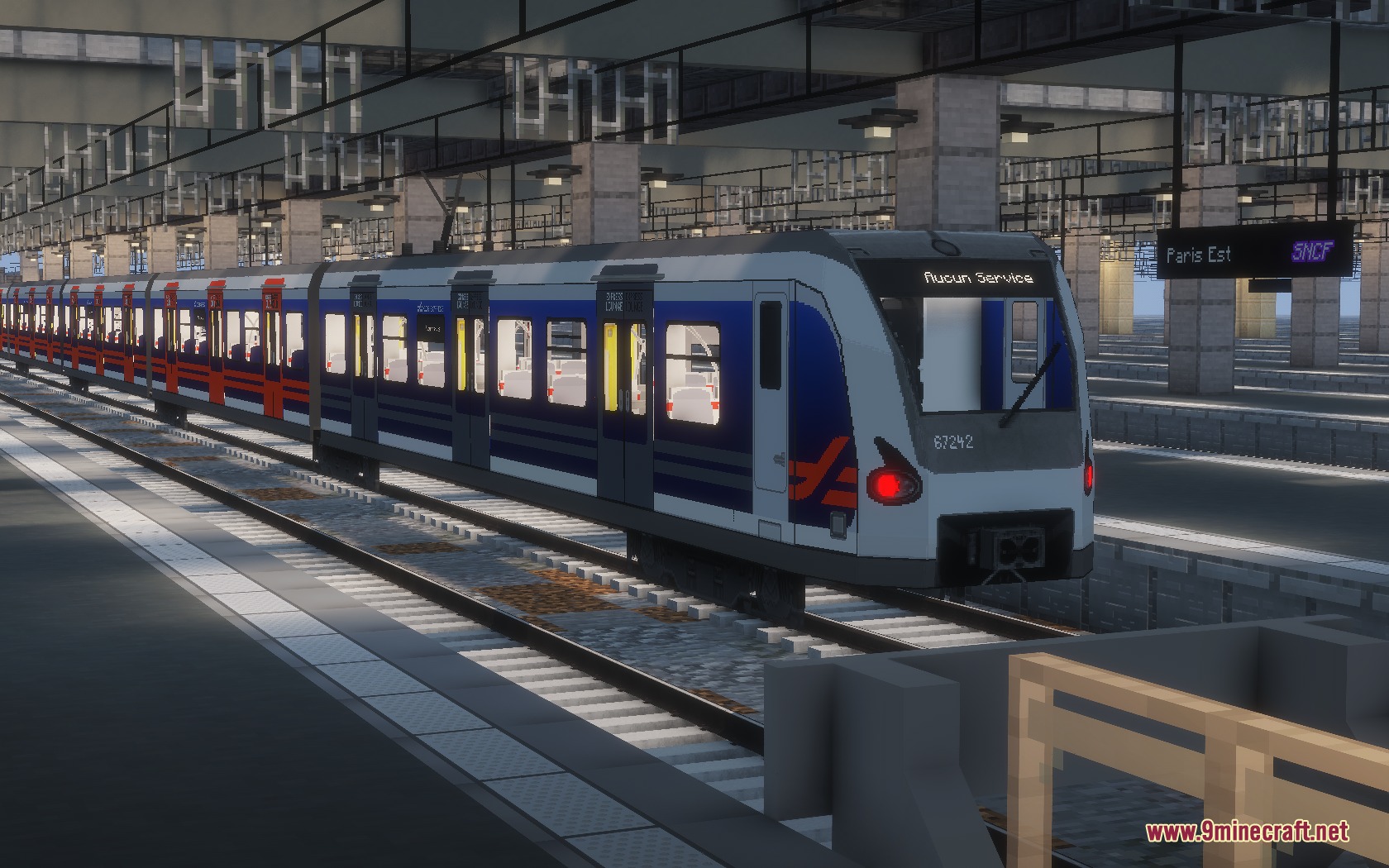 Steel Transit Blueprints Resource Pack Screenshot 4 A blue and white SNCF train stopped at a detailed Minecraft station platform