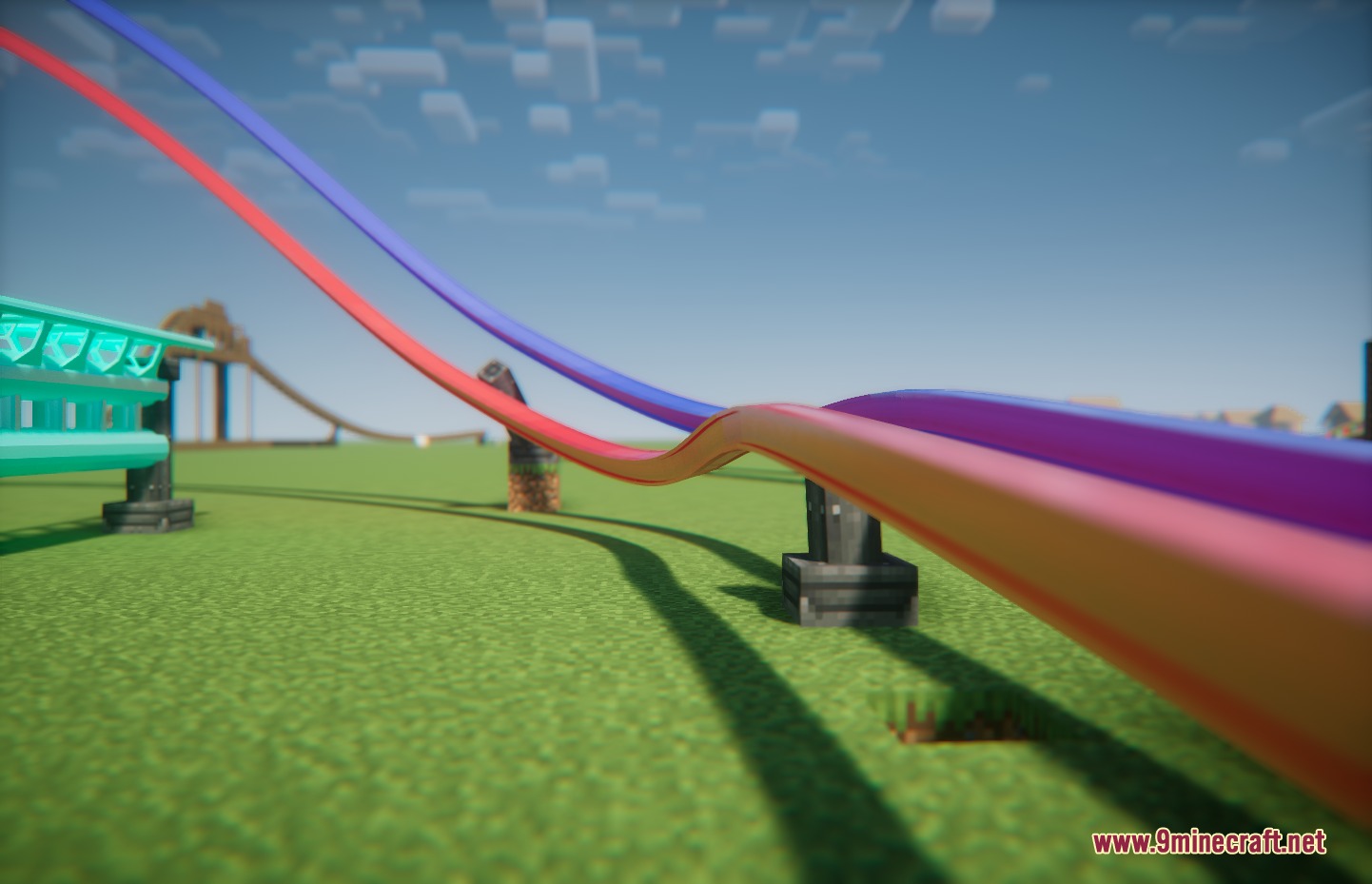 Steelbound Logistics Mod Screenshot 5 Vibrant red and purple roller coaster rails winding through a grassy landscape