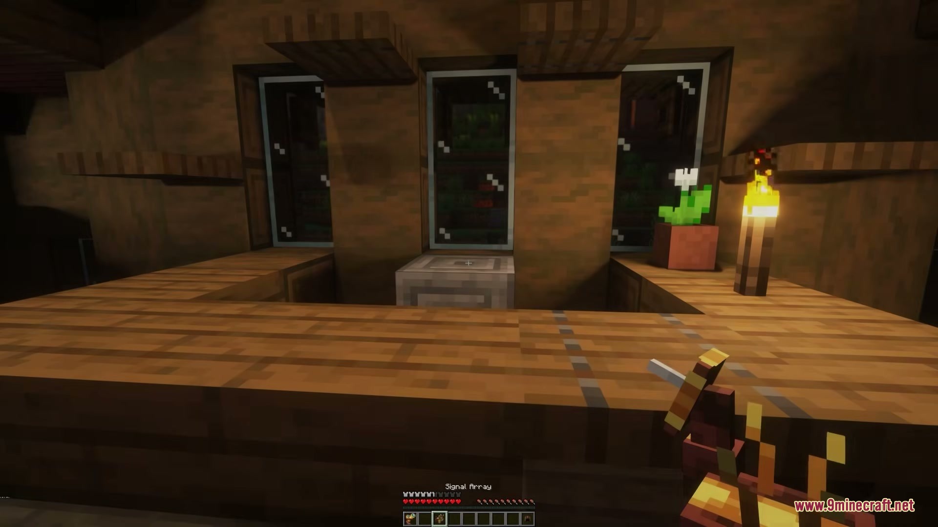 Player uses a Signal Tweaker to configure a Signal Array block indoors