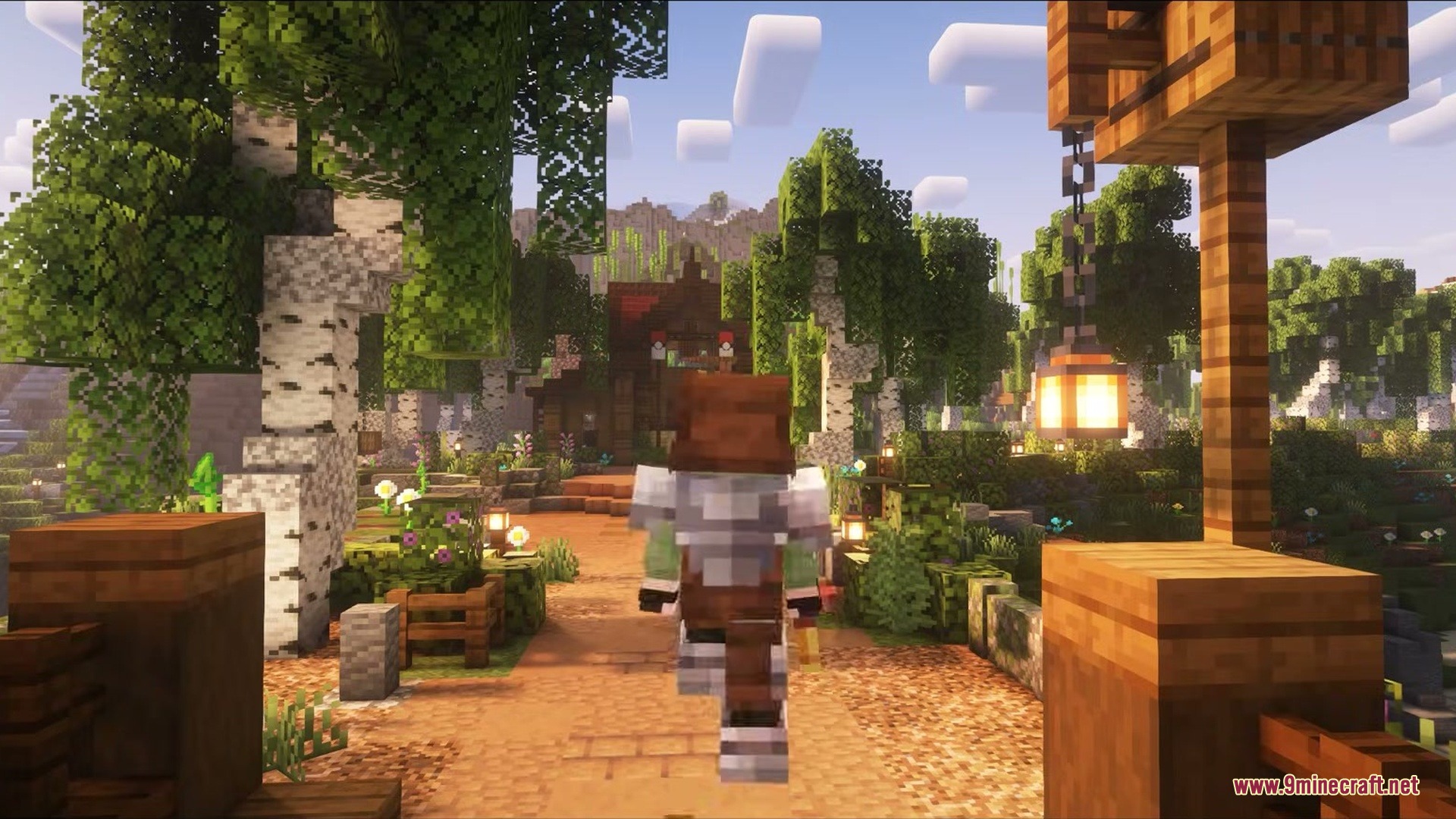 Player walking along a detailed path through a scenic birch forest village