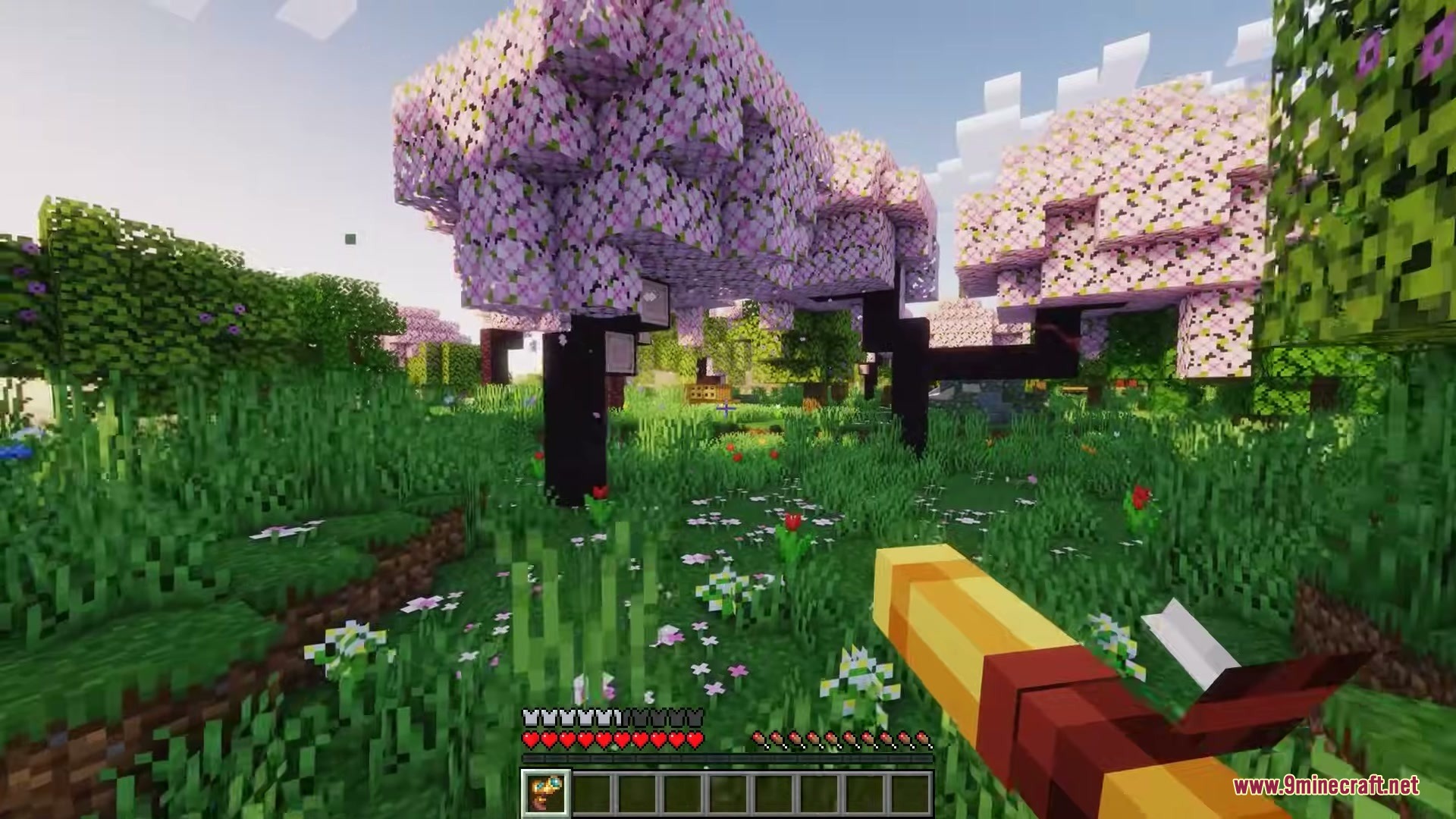 Player using the Signalscope tool to detect signals in a cherry blossom biome