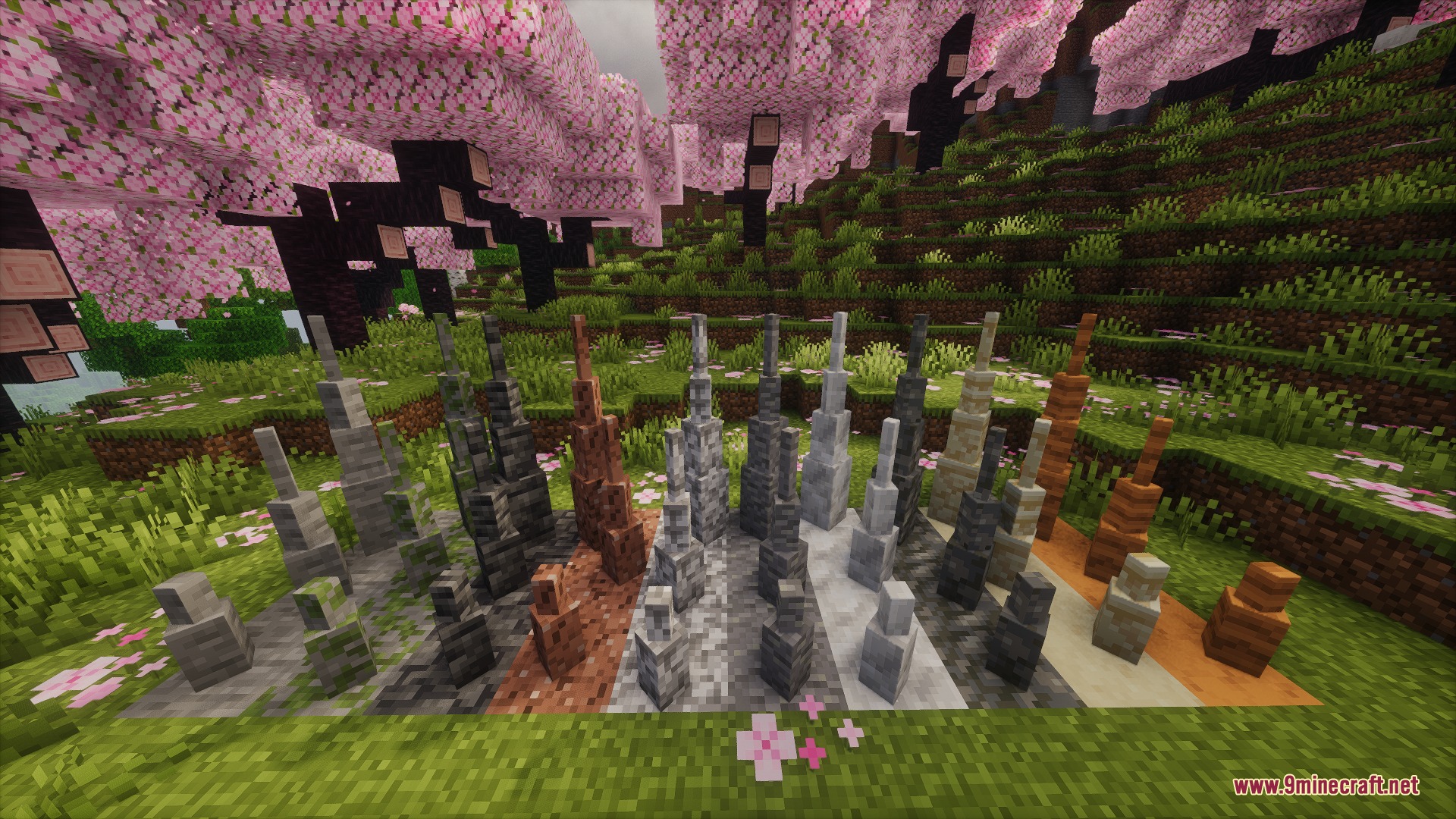 Subterranean Expansion Cave Update Mod Screenshot 1 Various stone stalagmites arranged on the grass in a cherry blossom biome