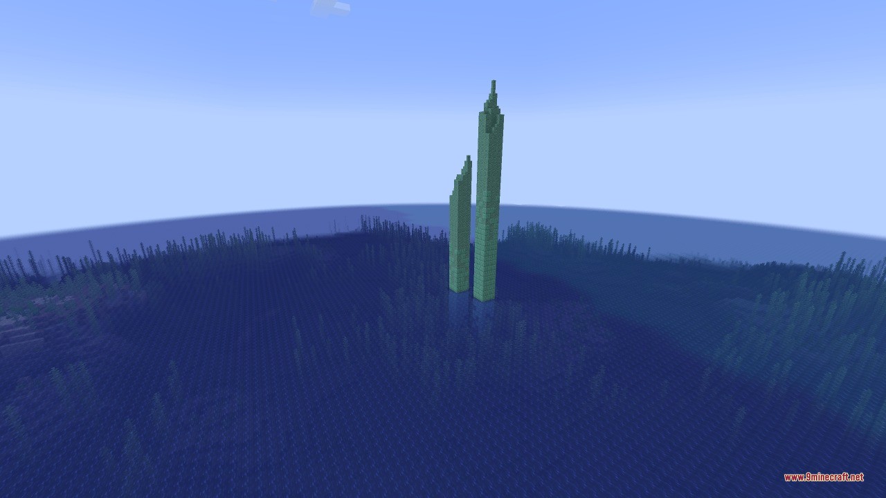 Two tall Sunken Spires structures rise from the vast blue ocean