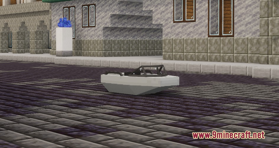 A small white motorboat sitting on a cobblestone road in a town