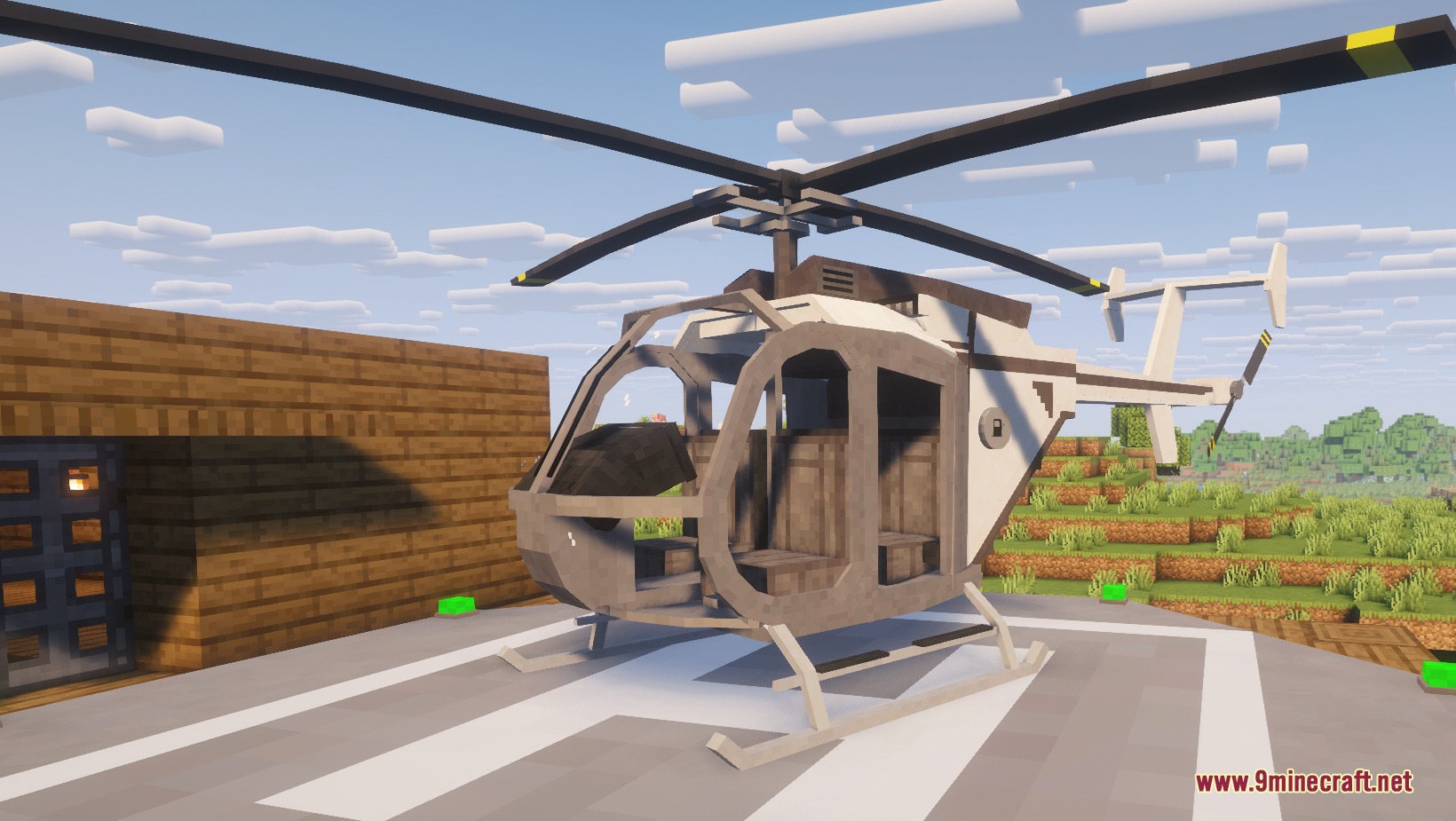 A white helicopter parked on a helipad outside a wooden building in Minecraft