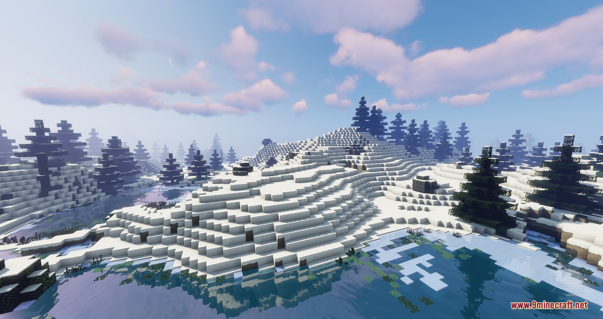 Snowy alpine forest featuring hardy pine trees and a frozen lake under clouds