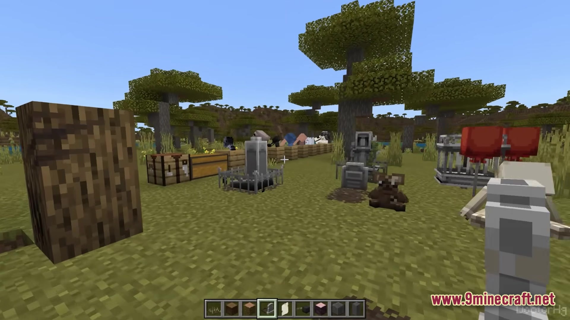 THE DWELLERS Modpack Screenshot 6 Various decorative items, machines, and mob heads placed in a savanna biome within Minecraft