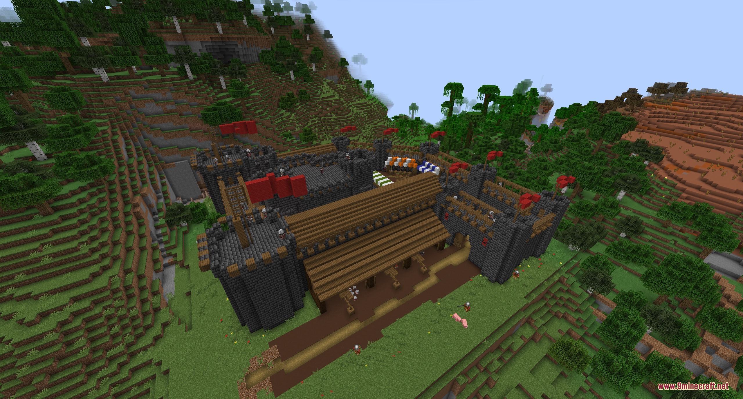 TKVM Enemies Mod Screenshot 7 A large medieval stone fortress with red flags and soldiers on guard