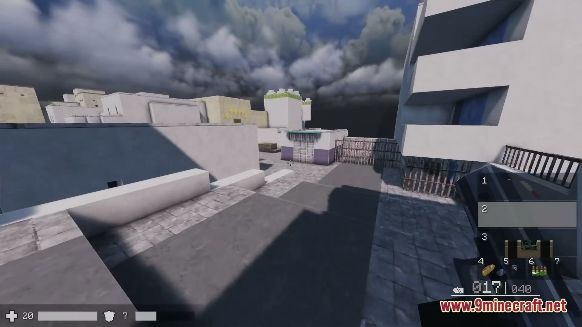 First-person perspective of a player holding a firearm in an urban environment with modern white buildings