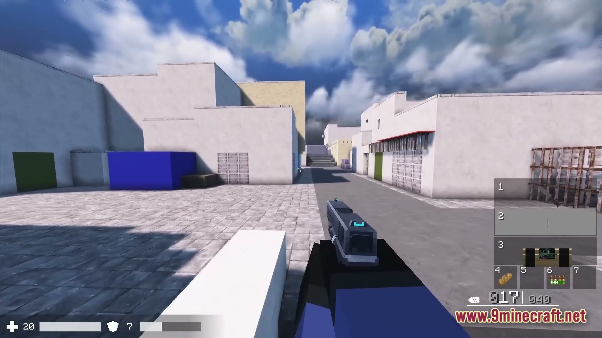 A first-person view of a player holding a handgun in an urban environment with white buildings