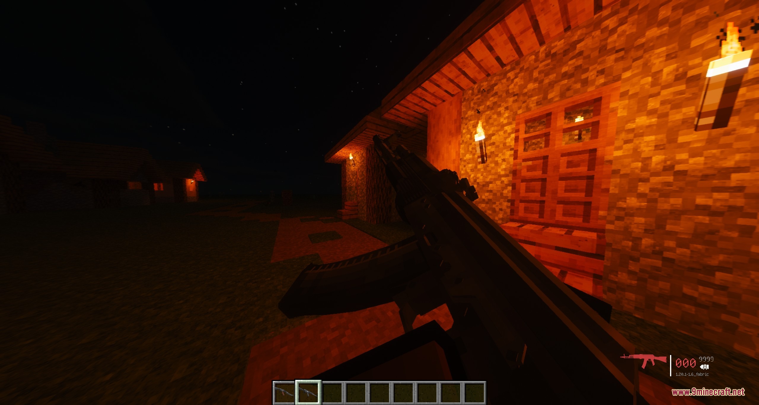 Tacz Recycling Mod Screenshot 3 First person view of a black assault rifle near a village at night