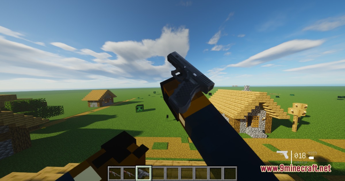 Tacz Recycling Mod Screenshot 8 Player holding a black pistol while standing near a village in Minecraft