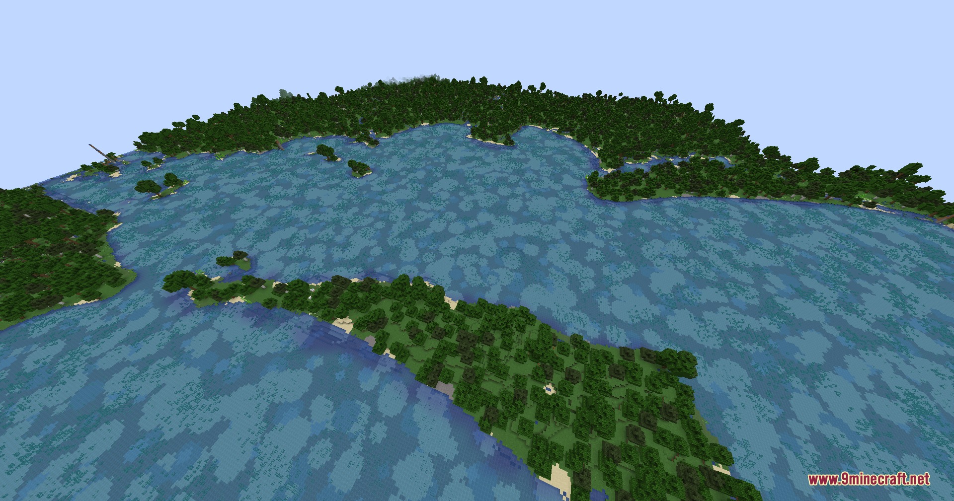 Terrarium Expanded Mod Screenshot 3 Aerial view of a vast ocean surrounded by dense green forests and islands