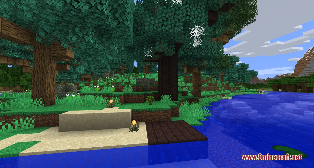Scenic Minecraft landscape featuring custom trees and cobwebs near a blue river