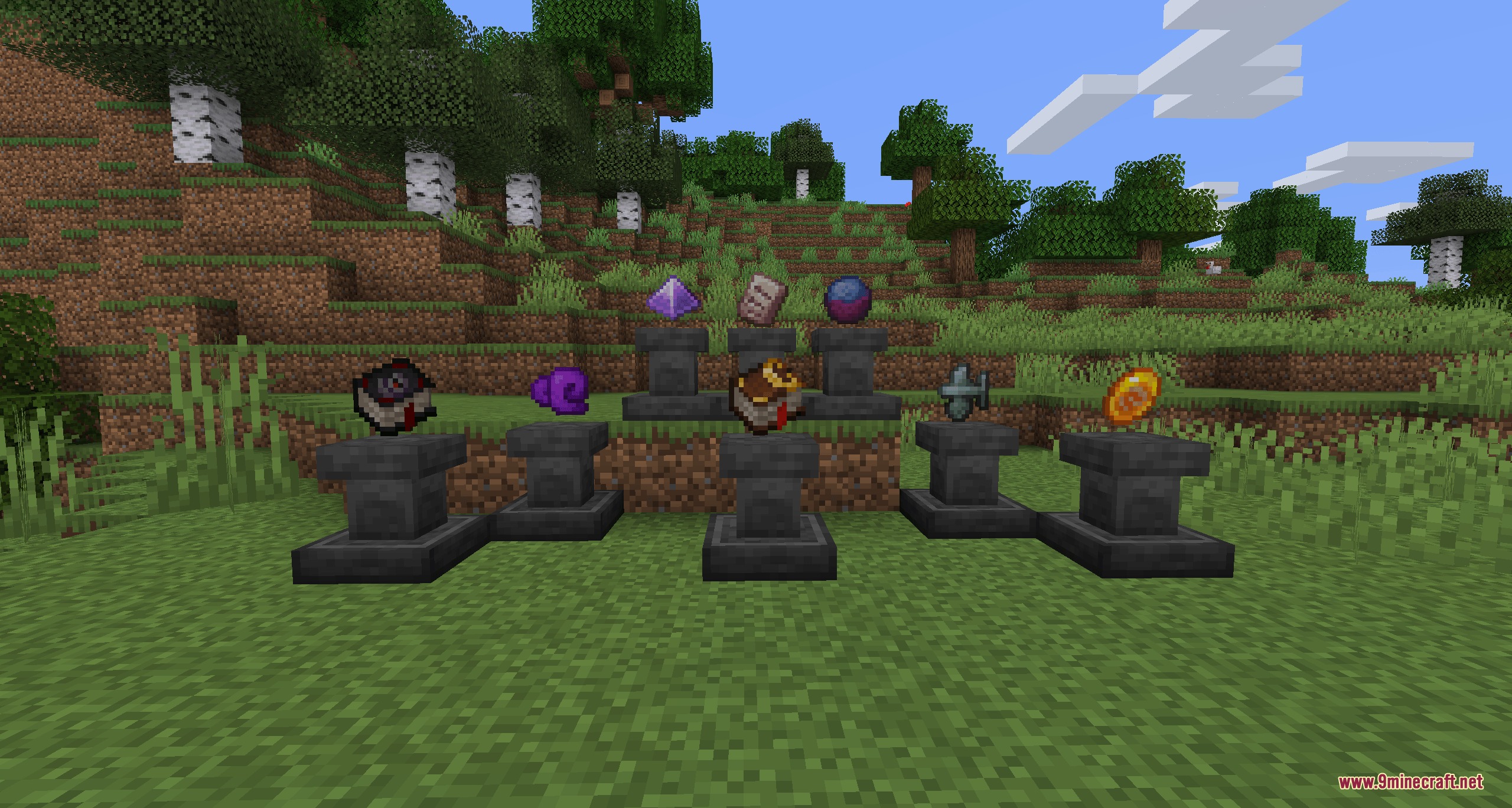Magical items and enchanted books displayed on stone pedestals in a forest