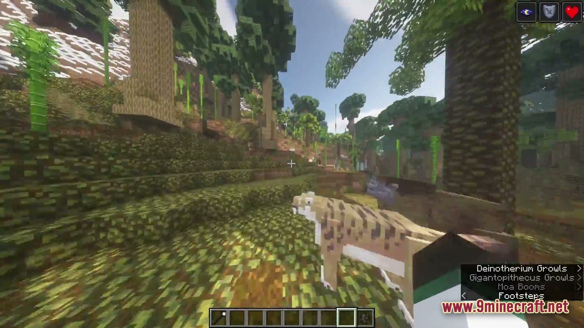 A prehistoric feline predator stands in a dense jungle biome with tall trees and bamboo