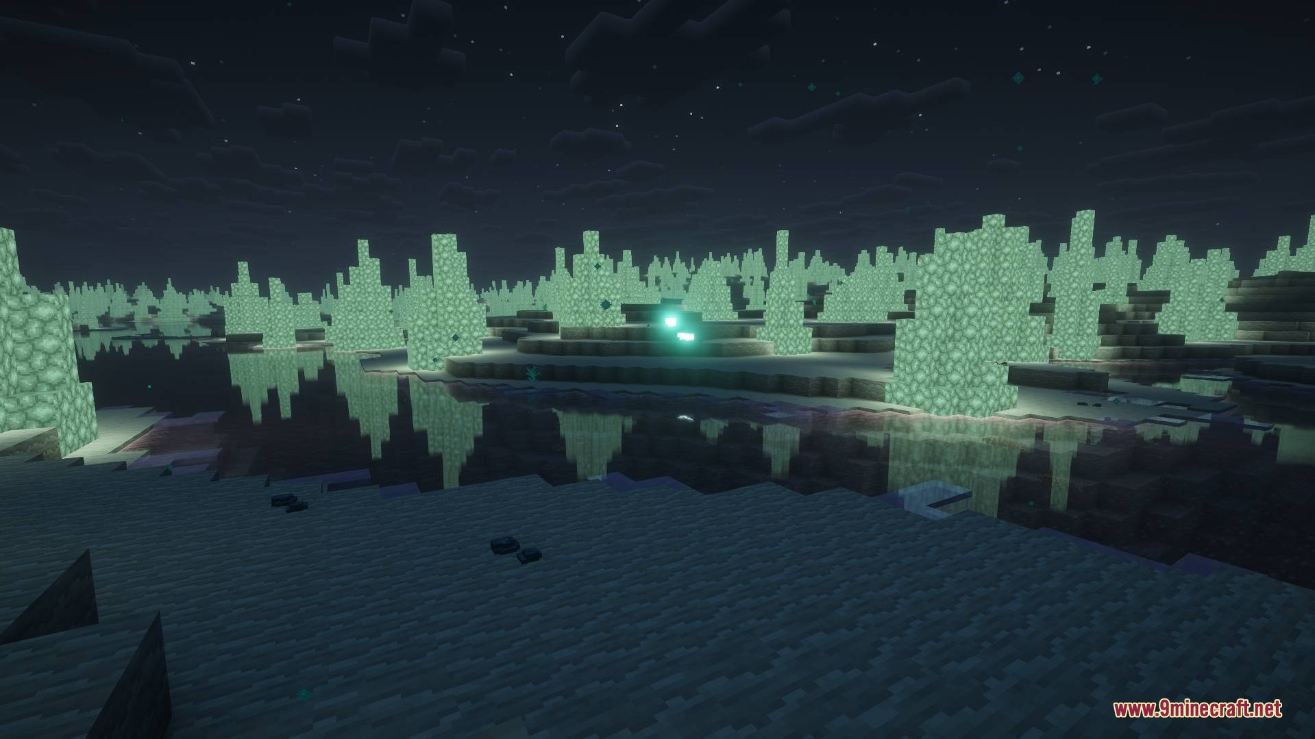 Crystalline spikes reflecting in a frozen lake within the Glacial Desert biome
