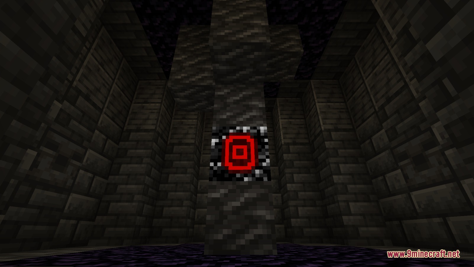 A glowing red Sacreligious Core block inside a dark stone brick room