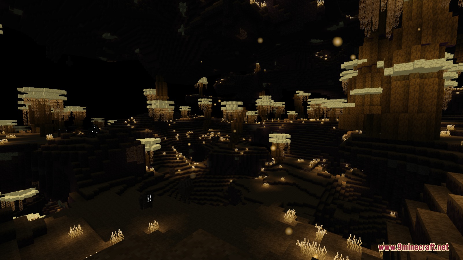 A dark dimension biome filled with glowing vegetation and tall rocky structures