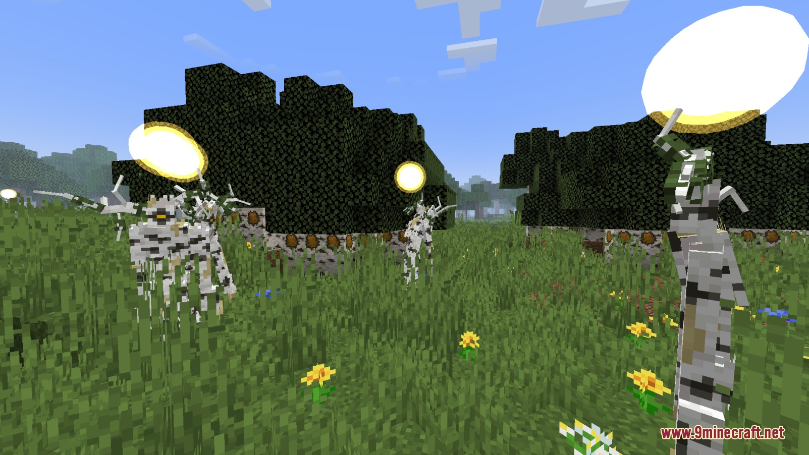 Friendly Burgeoning mobs with glowing yellow orbs standing in a grassy field