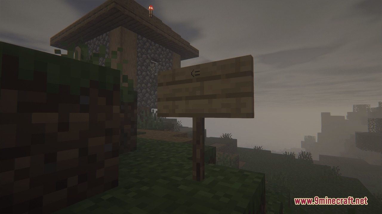 A wooden sign stands near a stone building under a thick foggy sky