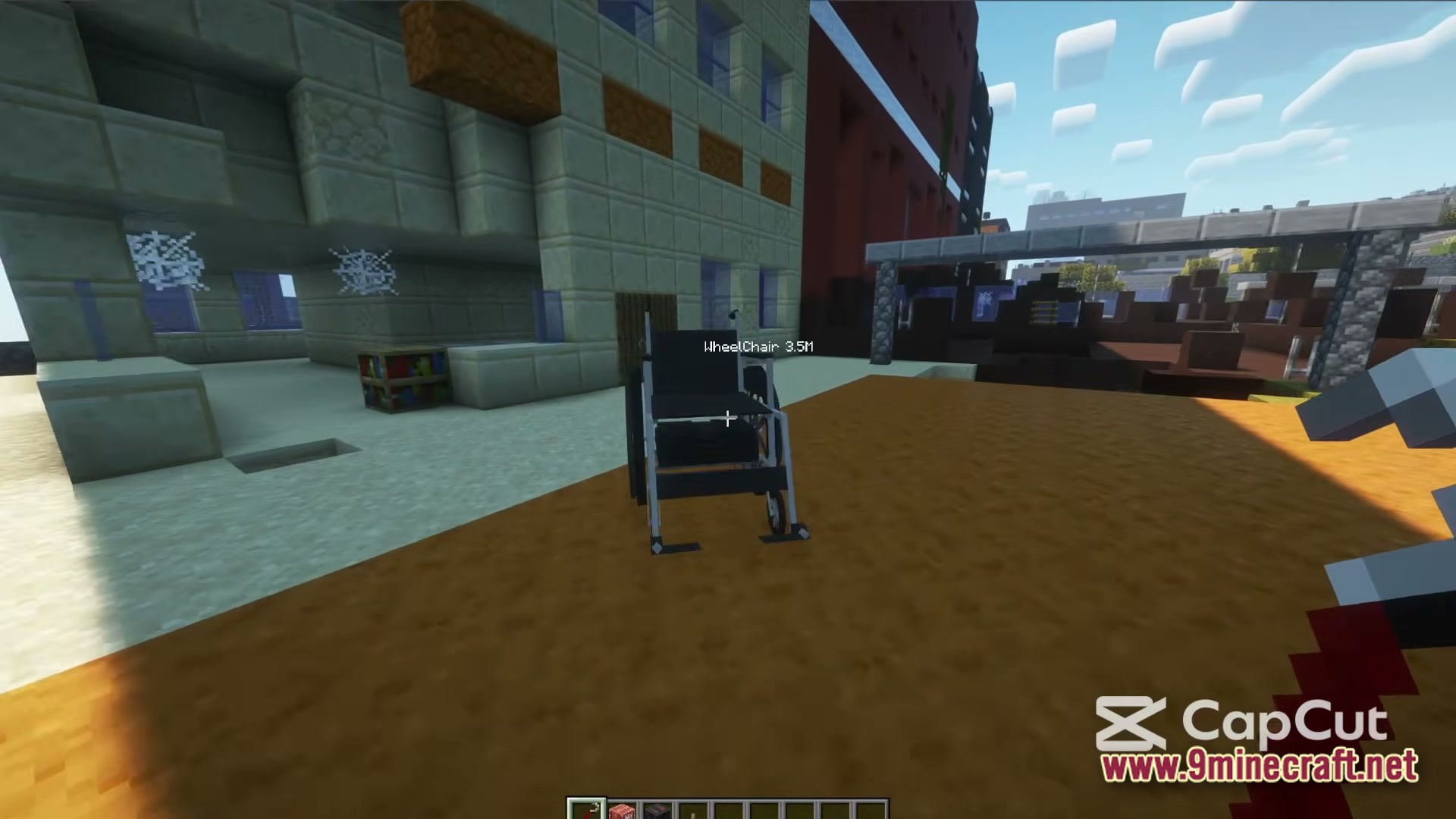 A black wheelchair entity sits on a dirt path near abandoned urban buildings and cobwebs