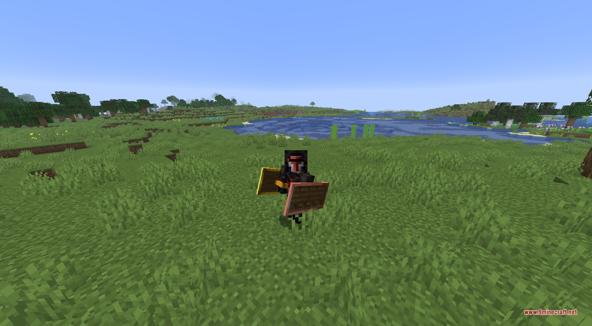 Tiered Shields Data Pack Screenshot 2 A player wearing netherite armor holding two different shields in a grassy field
