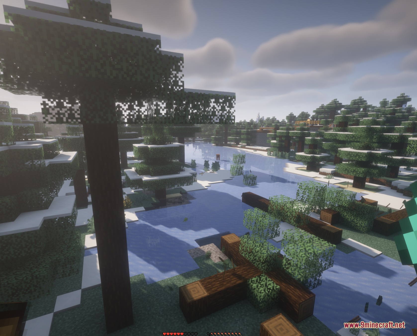Timber Gravity Pulse Mod Screenshot 2 Felled logs lying on the ground in a snowy Minecraft forest landscape