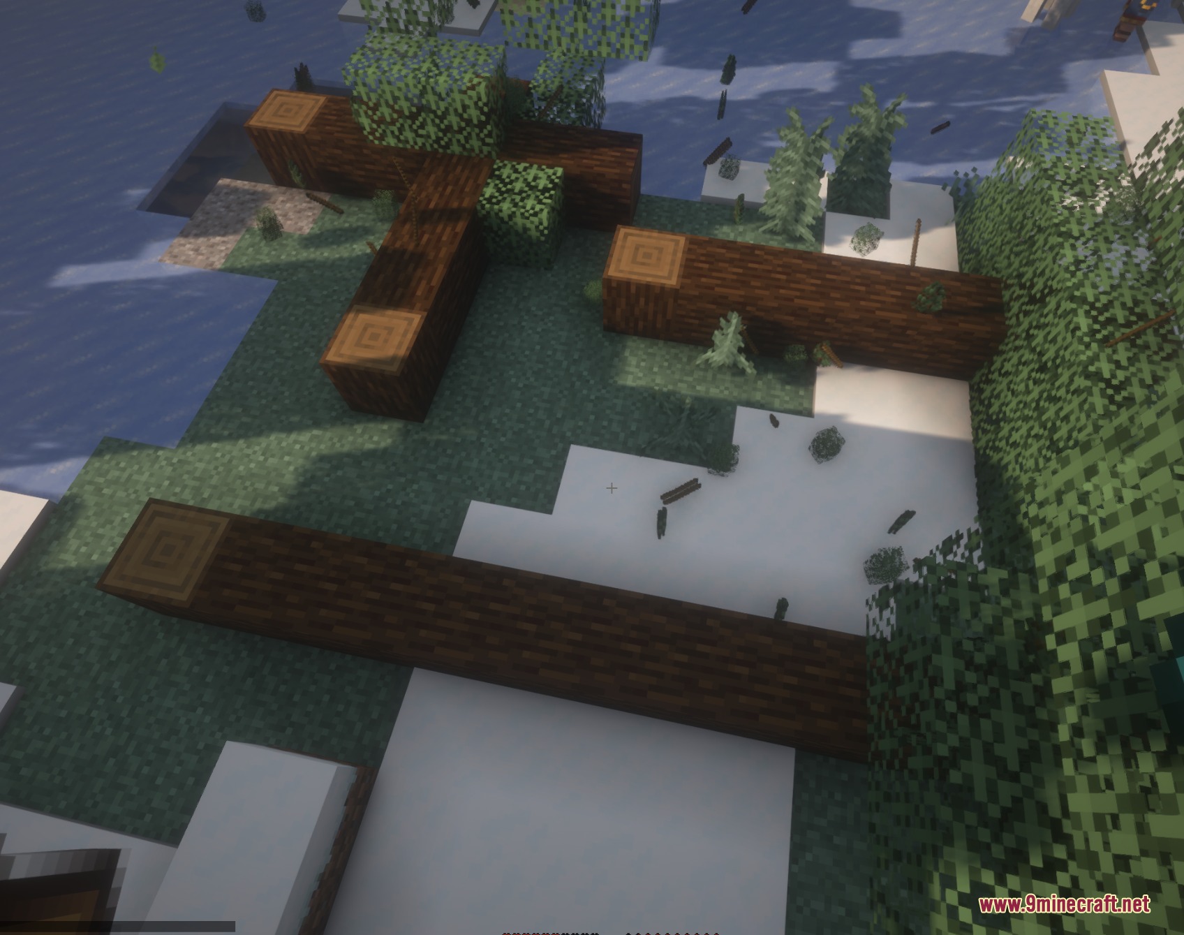 Timber Gravity Pulse Mod Screenshot 4 Fallen tree trunks lying on the snowy ground in a Minecraft forest biome