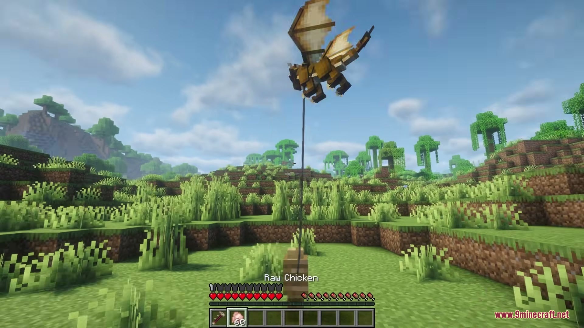 A tiny dragon flying while attached to a wooden fence post with a lead