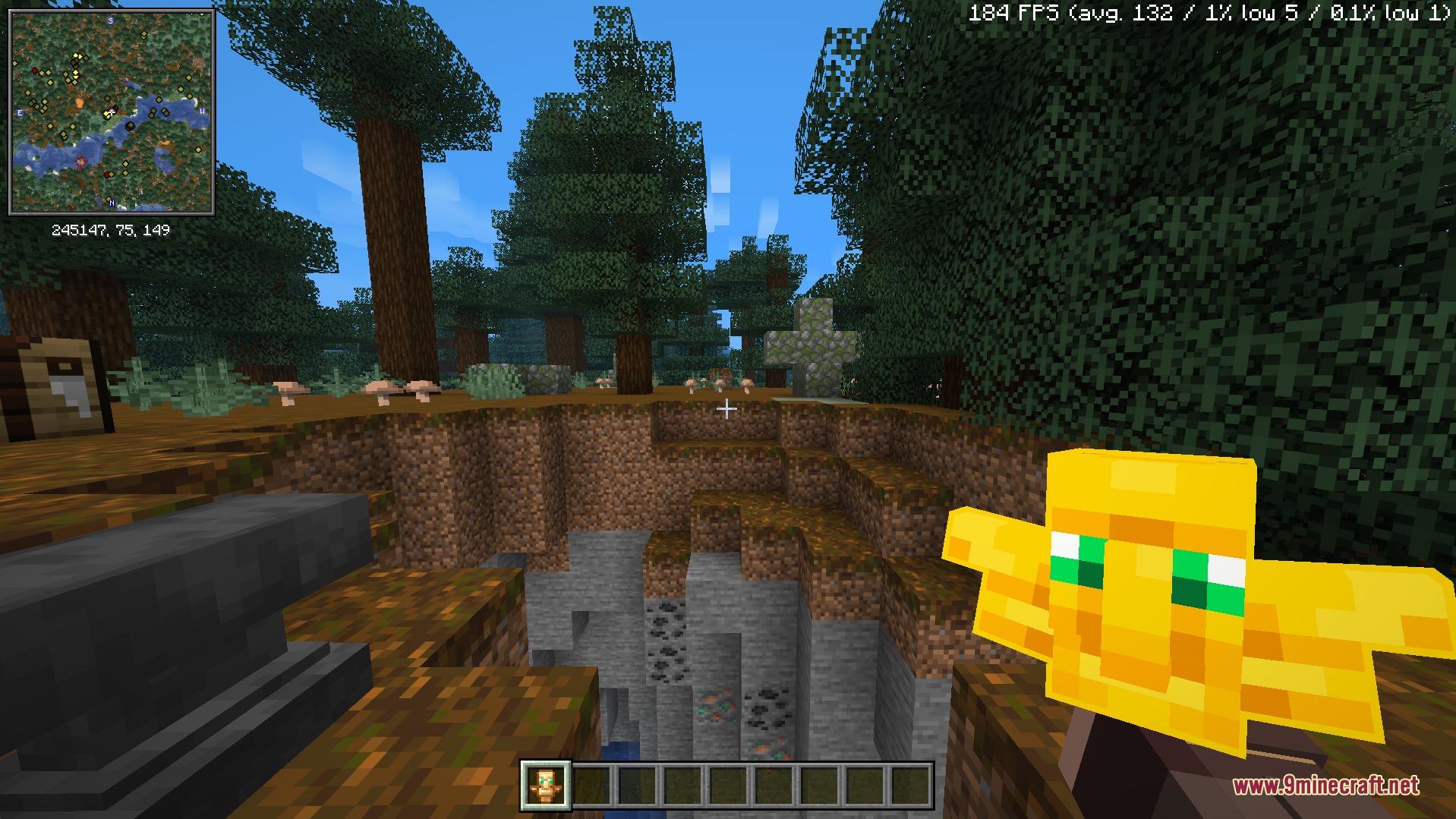 Totem & Stuff Resource Pack Screenshot 2 A player holds a custom translucent totem model while standing near a ravine